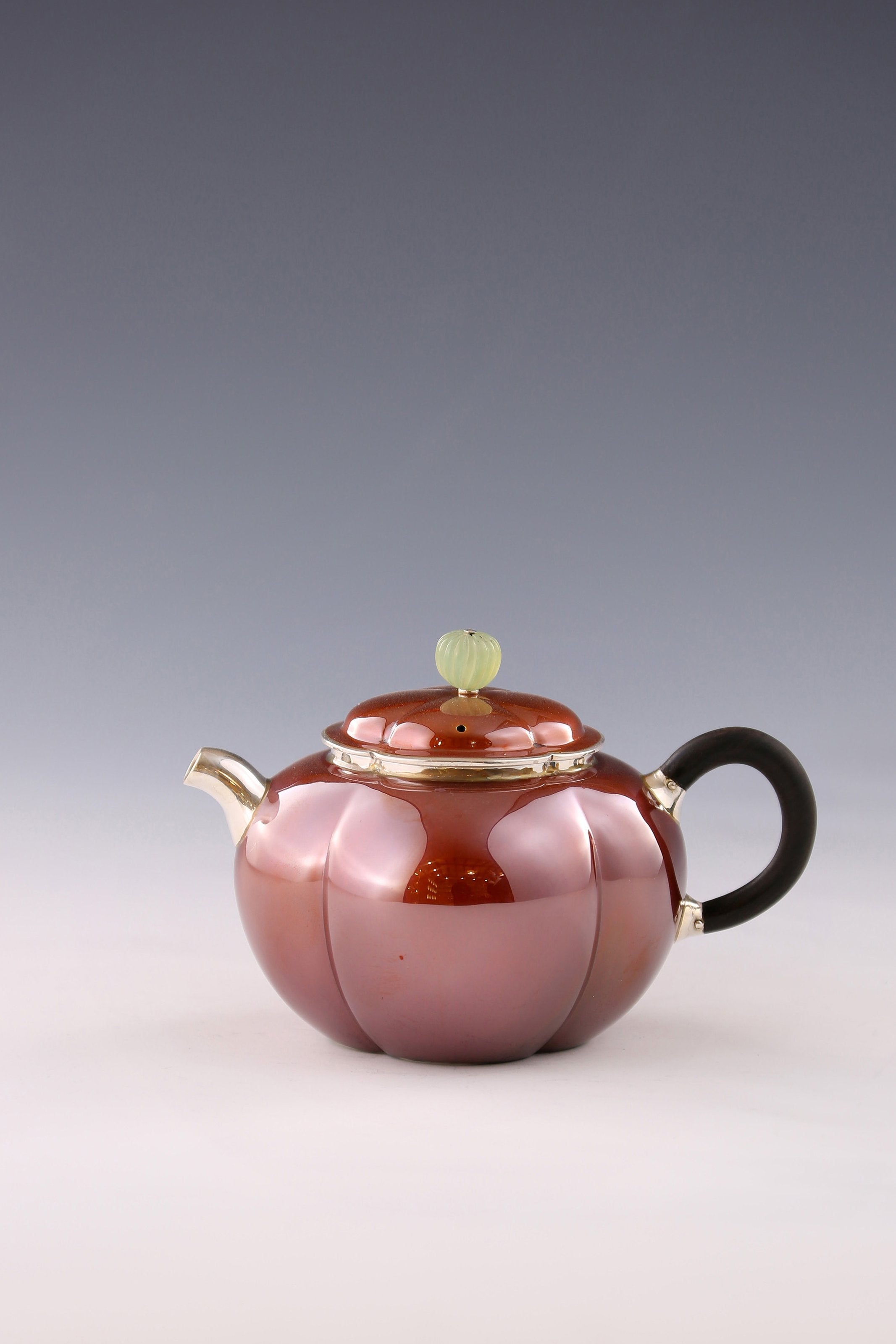 A set of Ruyi petal-shaped copper-plated silver teapot and serving cup