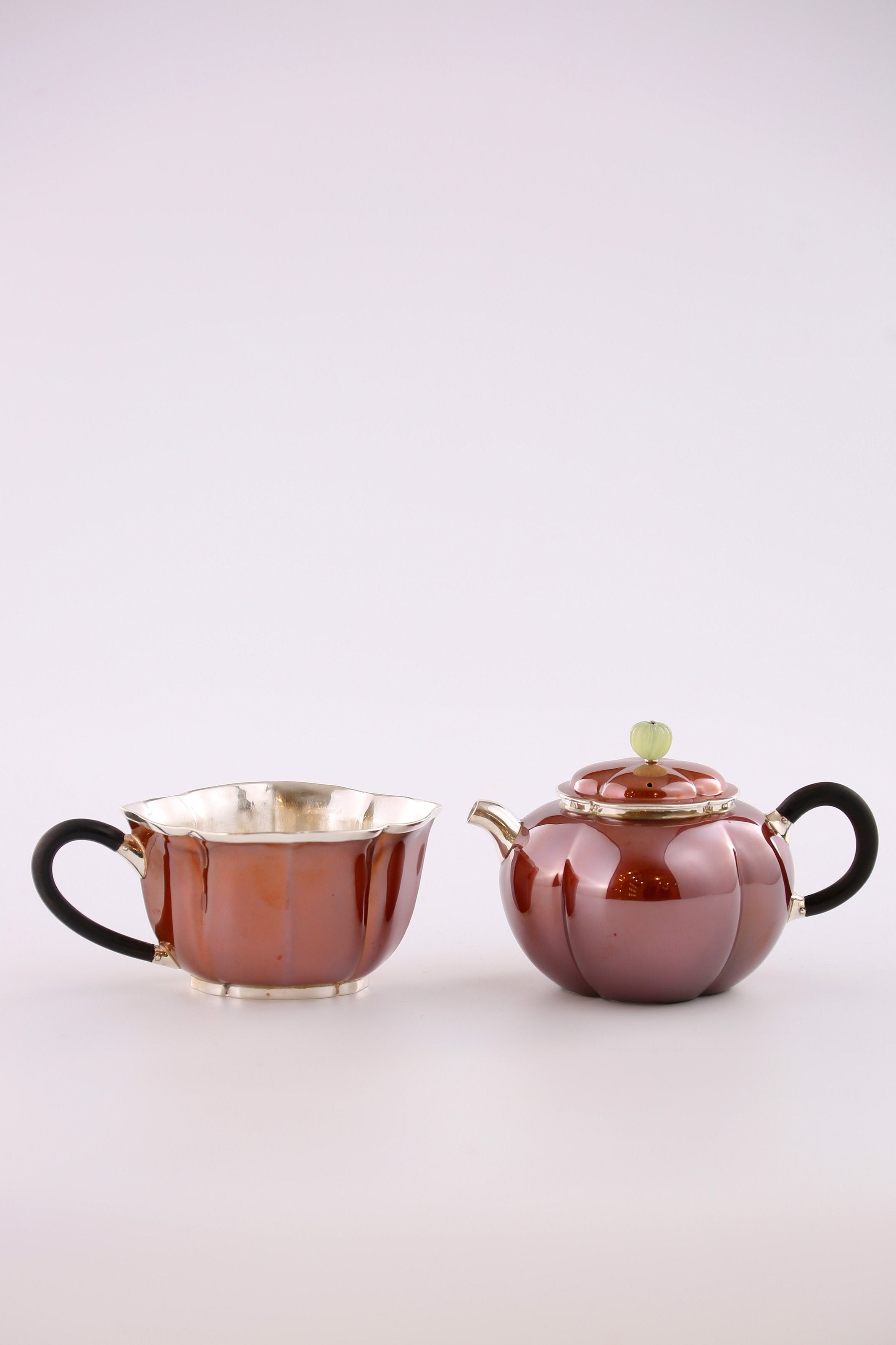 A set of Ruyi petal-shaped copper-plated silver teapot and serving cup
