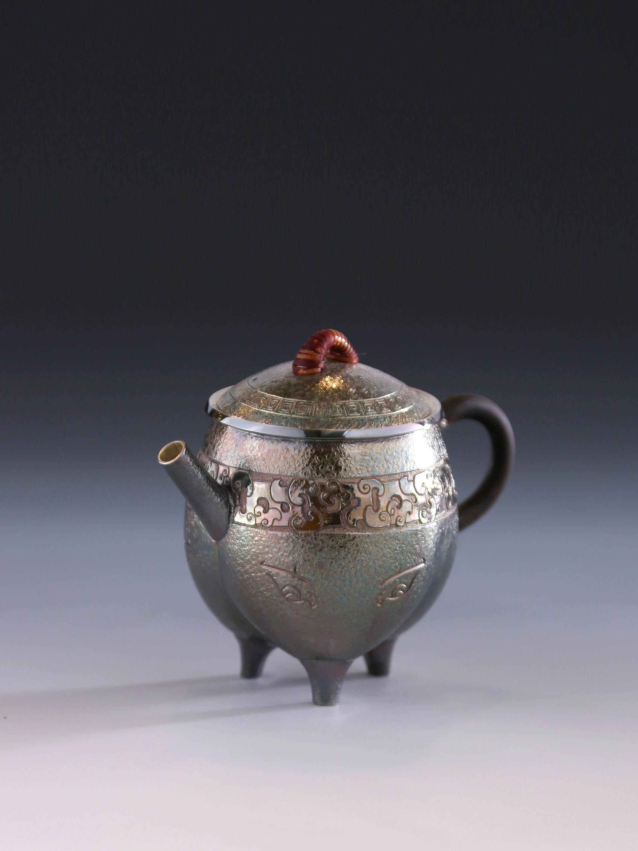 Three-legged tripod with animal motifs