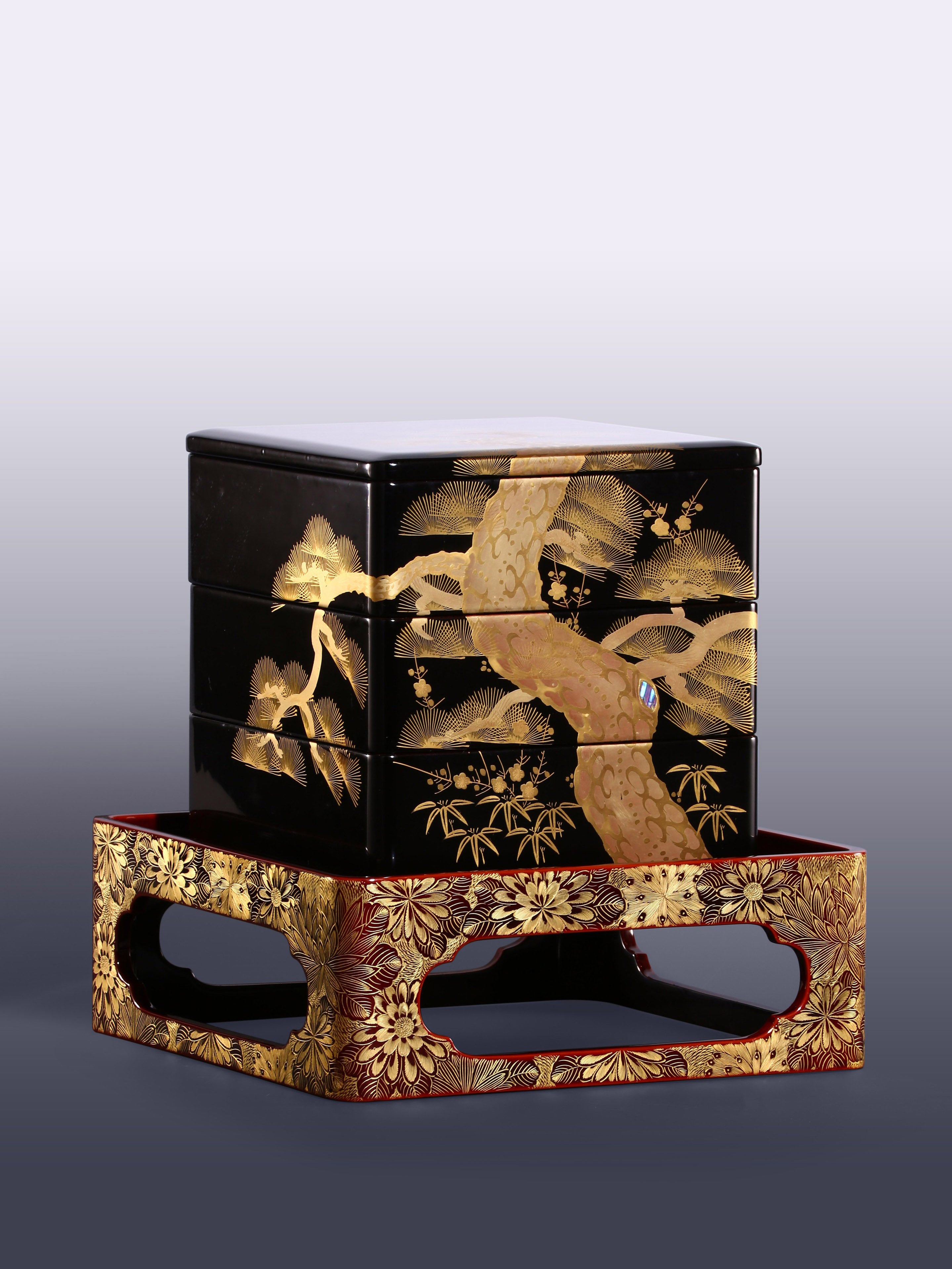 Japanese Meiji period tea box with pine, bamboo, and plum design, tea stall with chrysanthemum pattern.