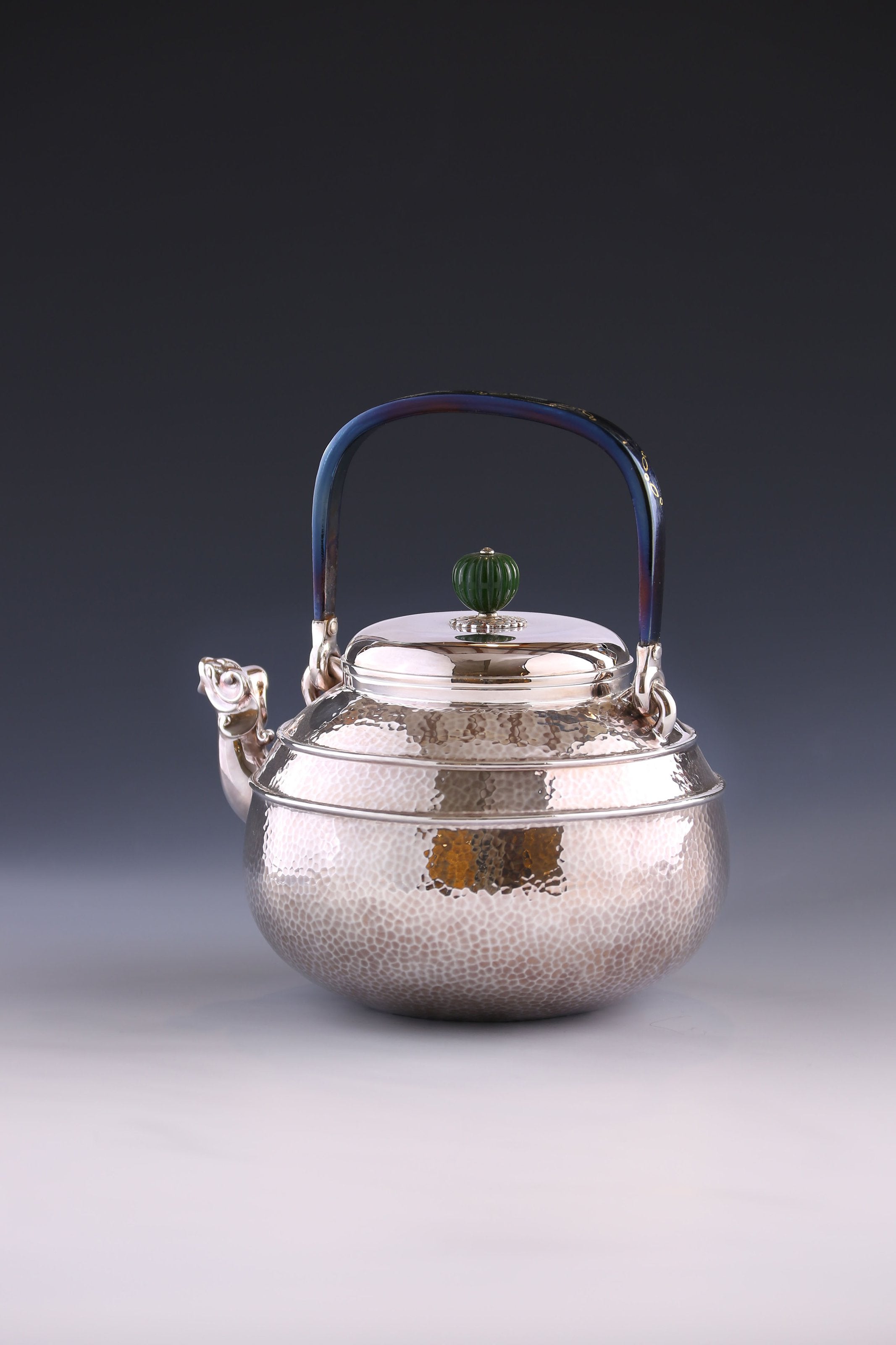 Silver ewer with animal-shaped mouth and double waistline