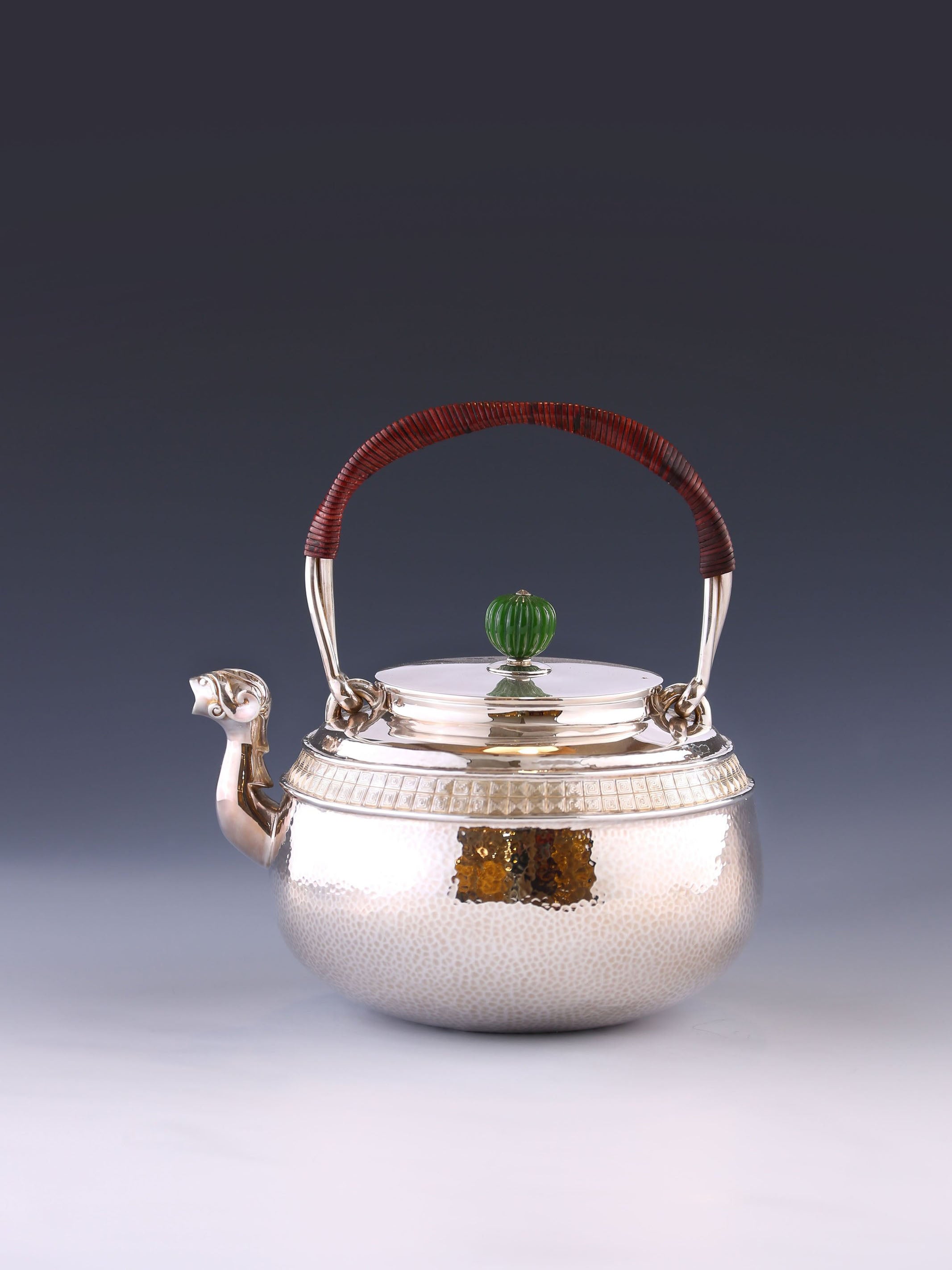 Silver ewer with animal-shaped mouth and double waistline fretwork