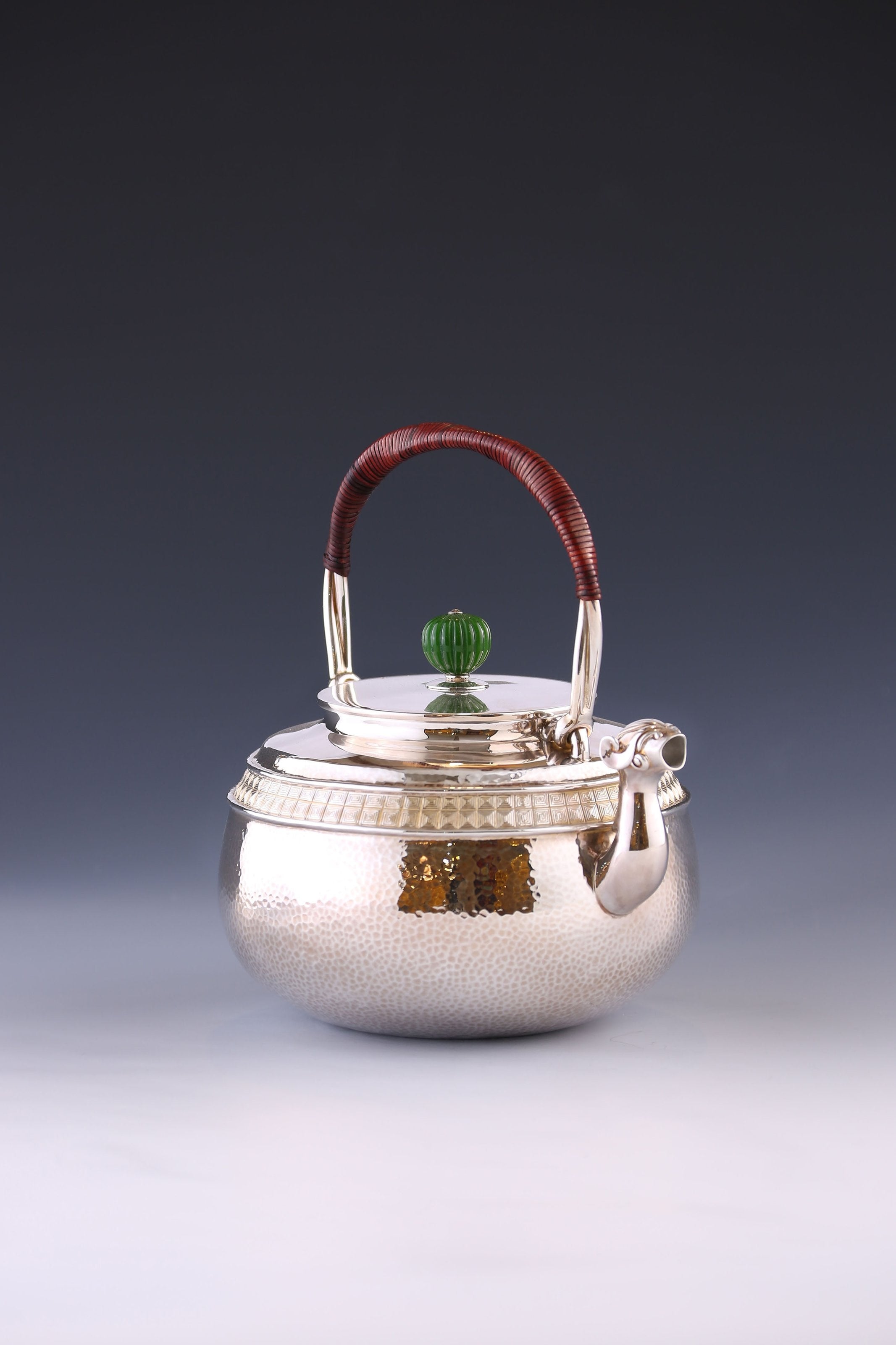 Silver ewer with animal-shaped mouth and double waistline fretwork