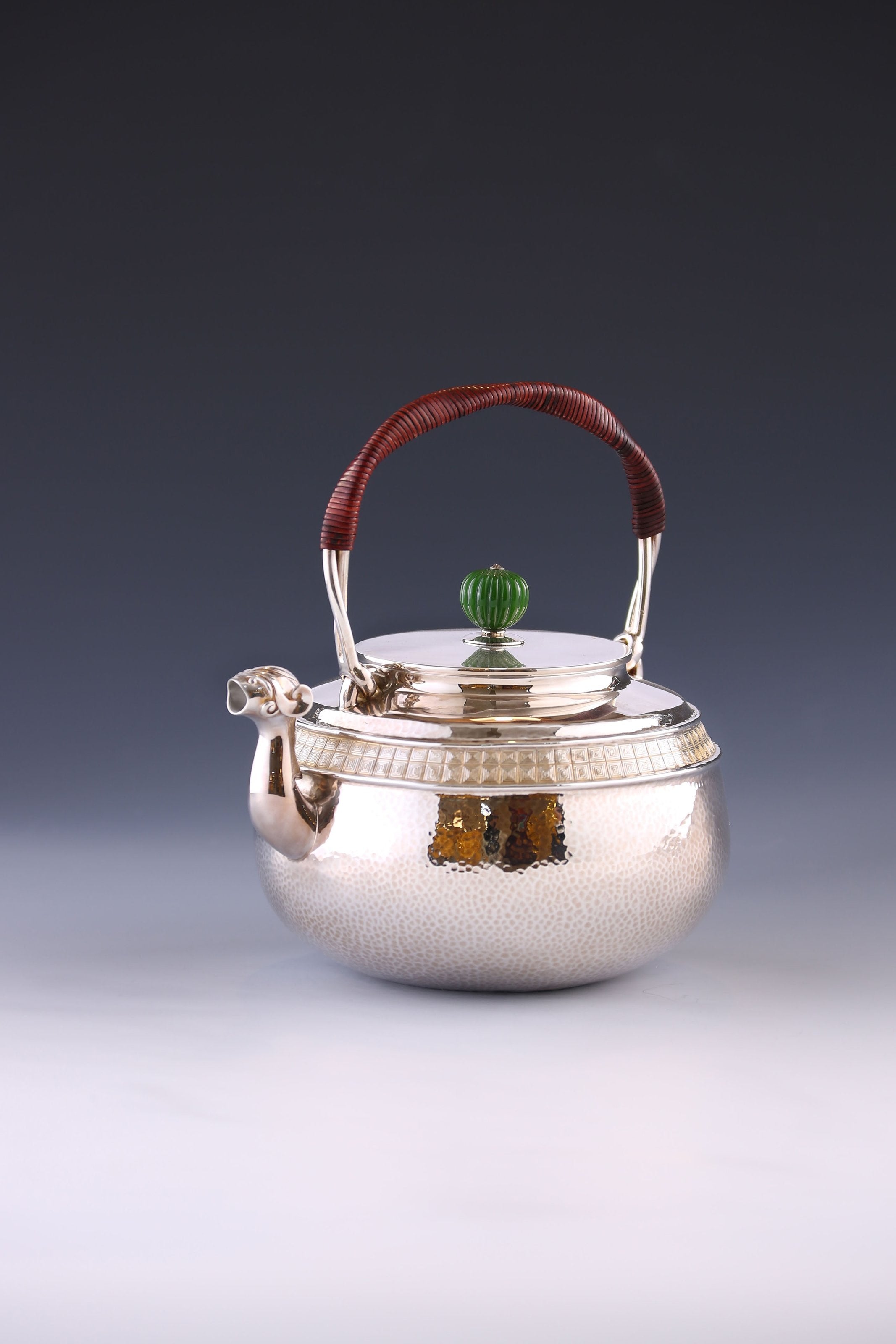 Silver ewer with animal-shaped mouth and double waistline fretwork