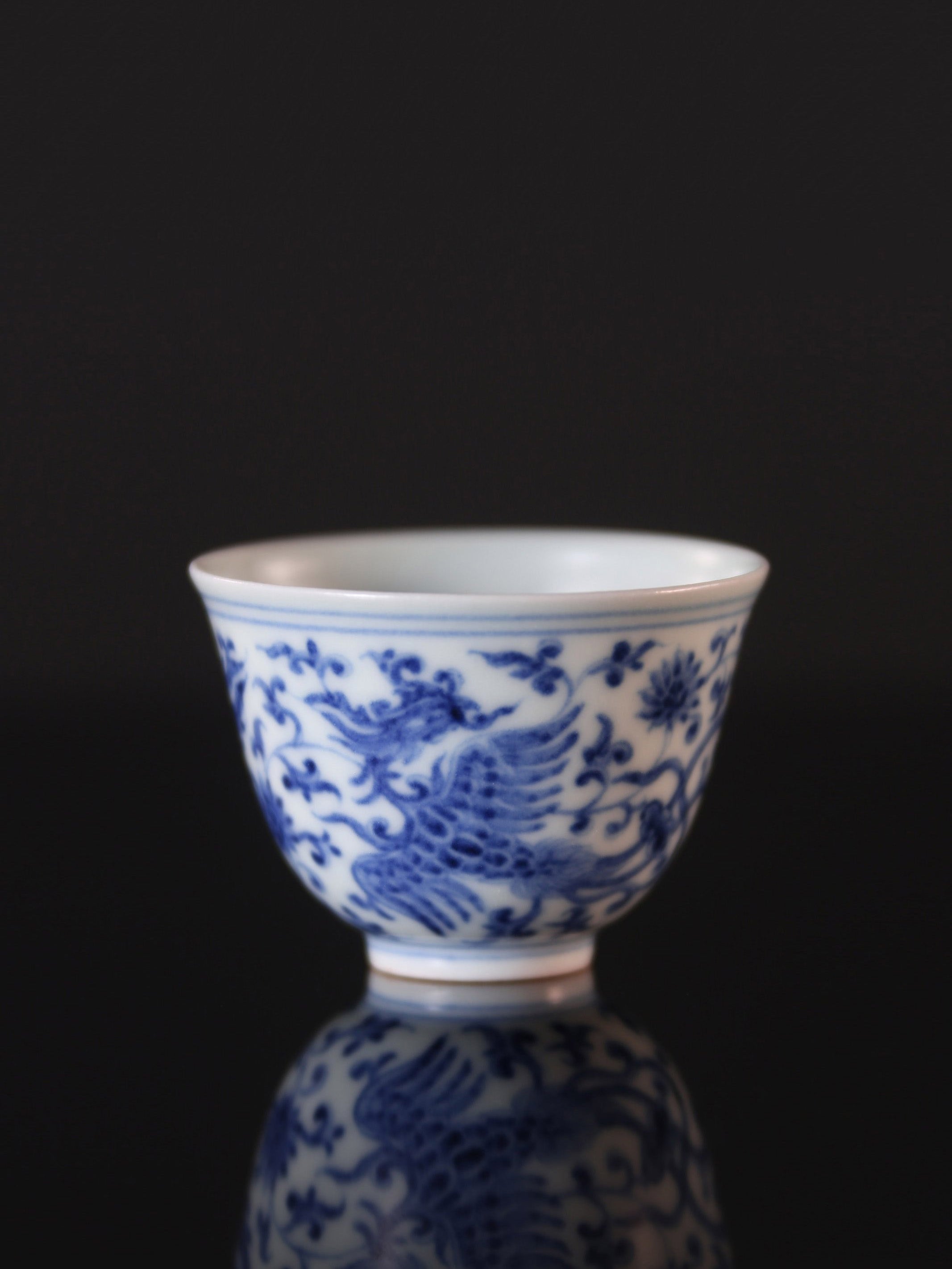 Blue and white porcelain cup with phoenixes amidst lotus scrolls and flared rim