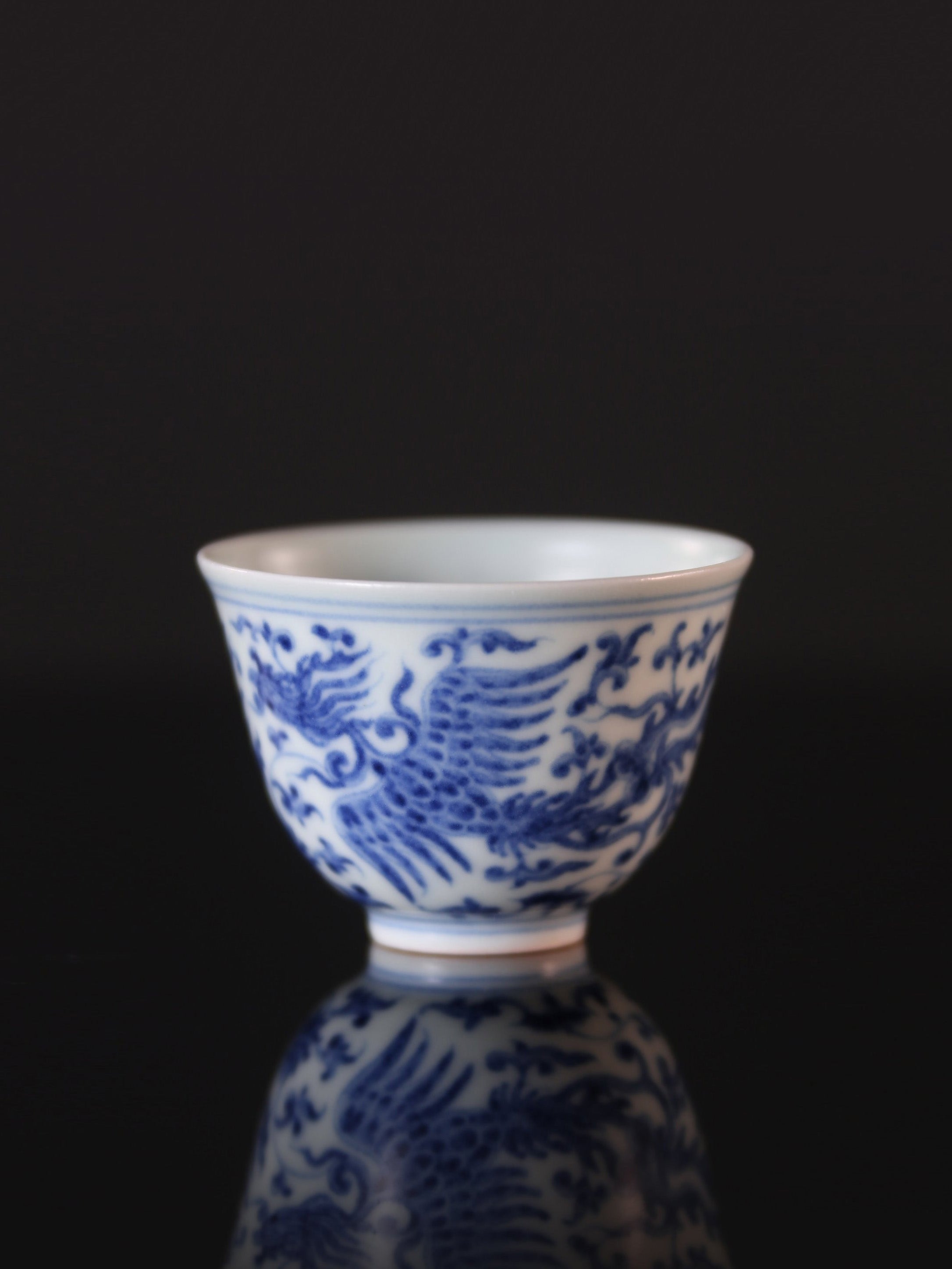 Blue and white porcelain cup with phoenixes amidst lotus scrolls and flared rim