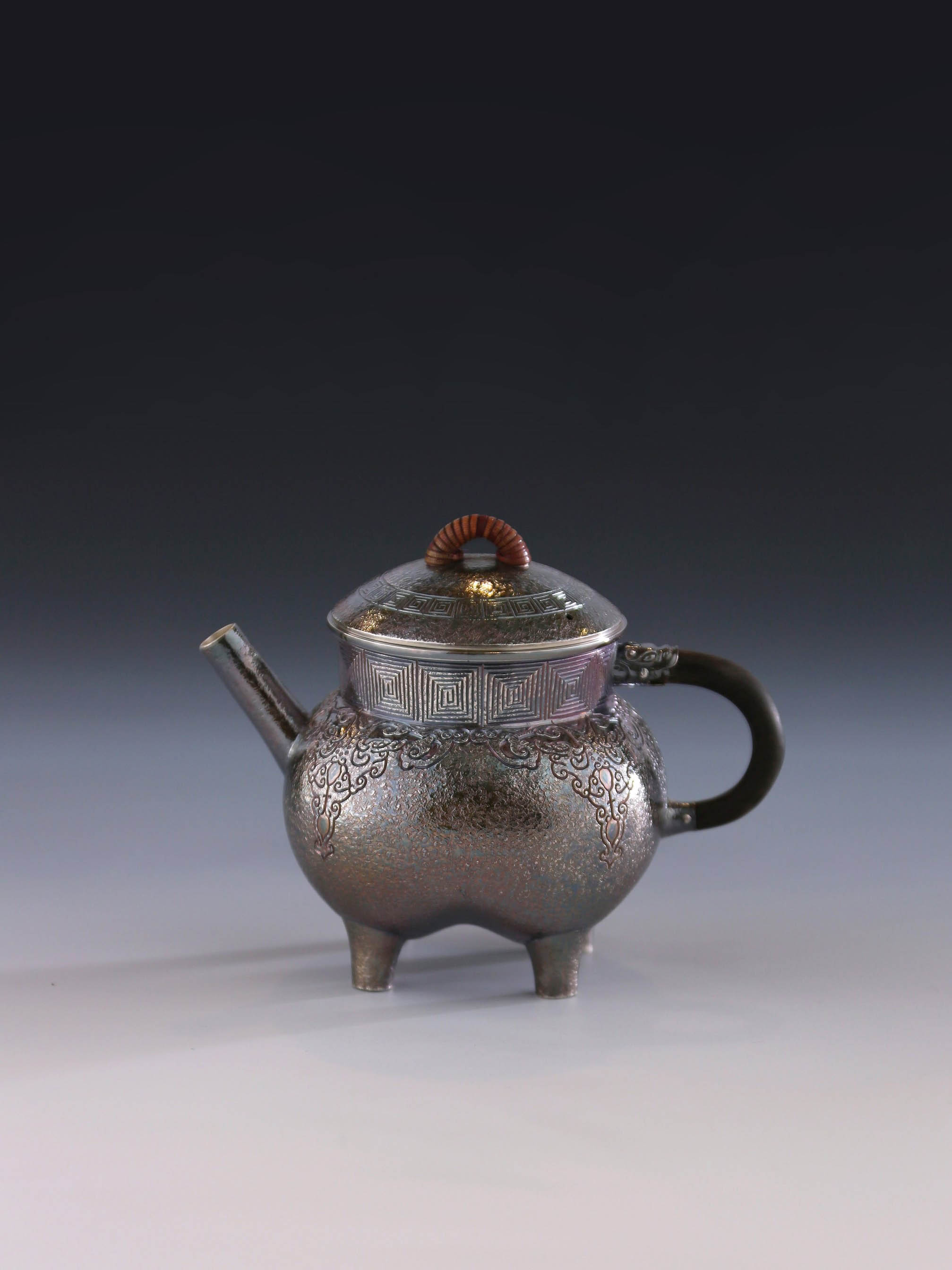 Four-legged silver ewer with dragon design