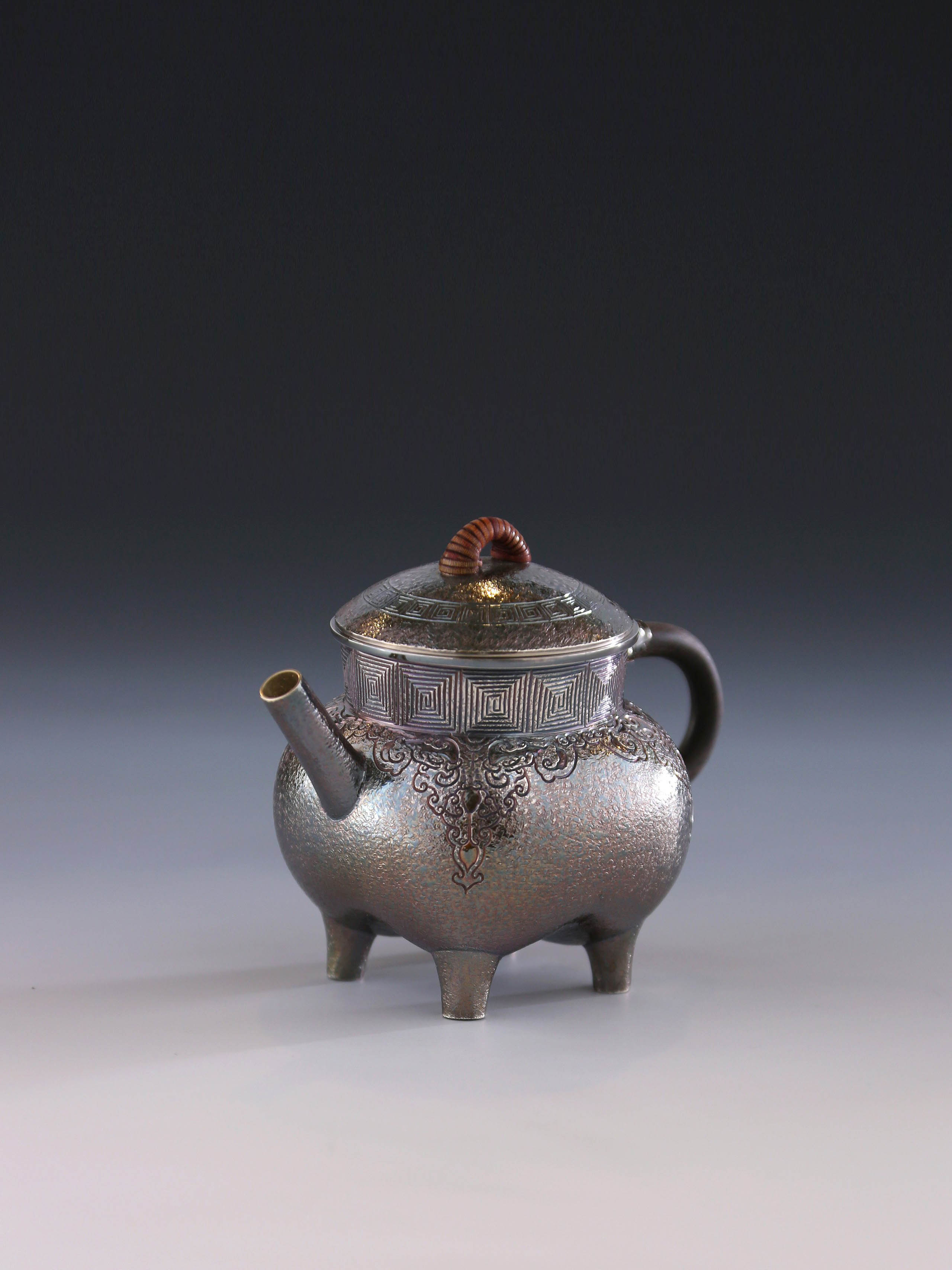 Four-legged silver ewer with dragon design