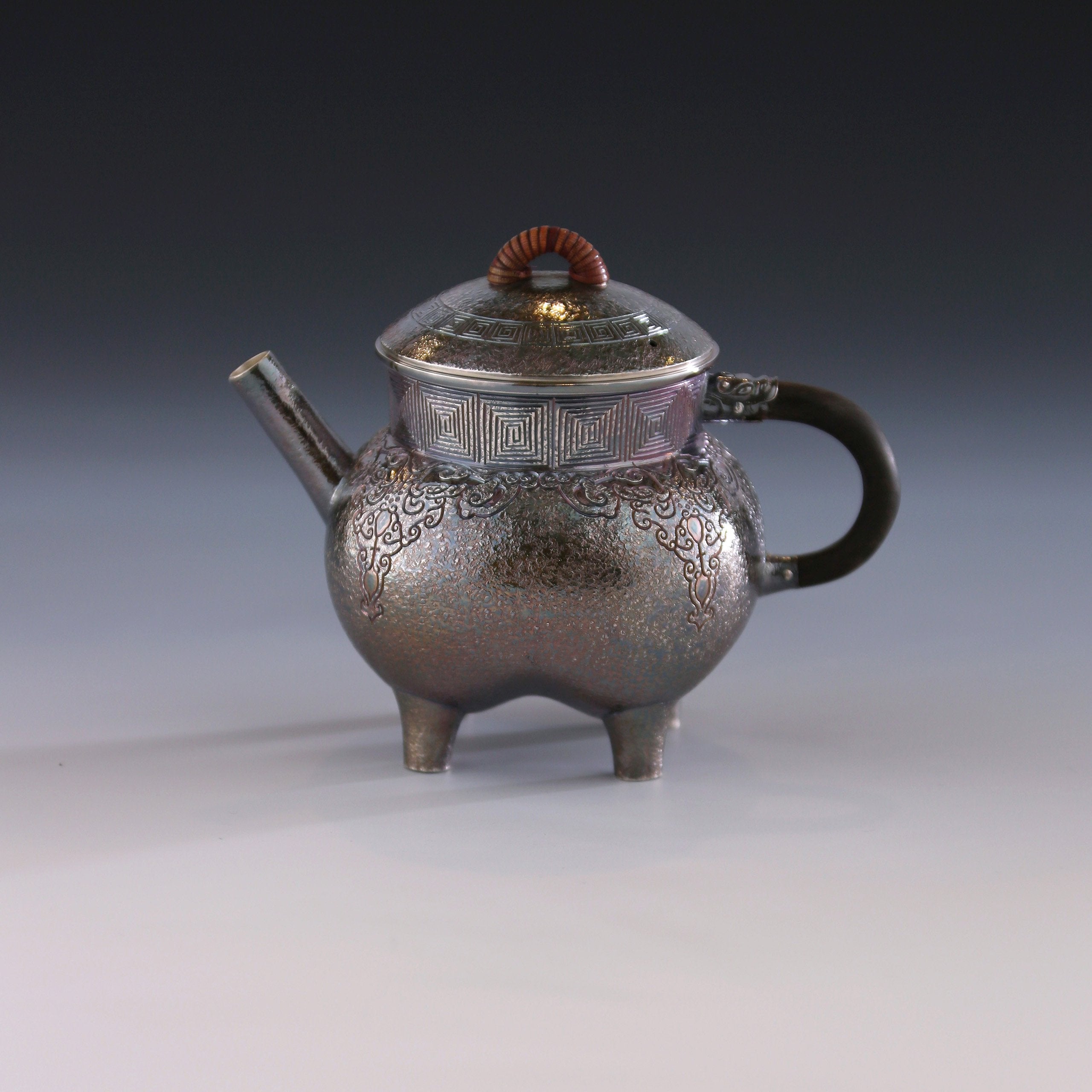 Four-legged silver ewer with dragon design
