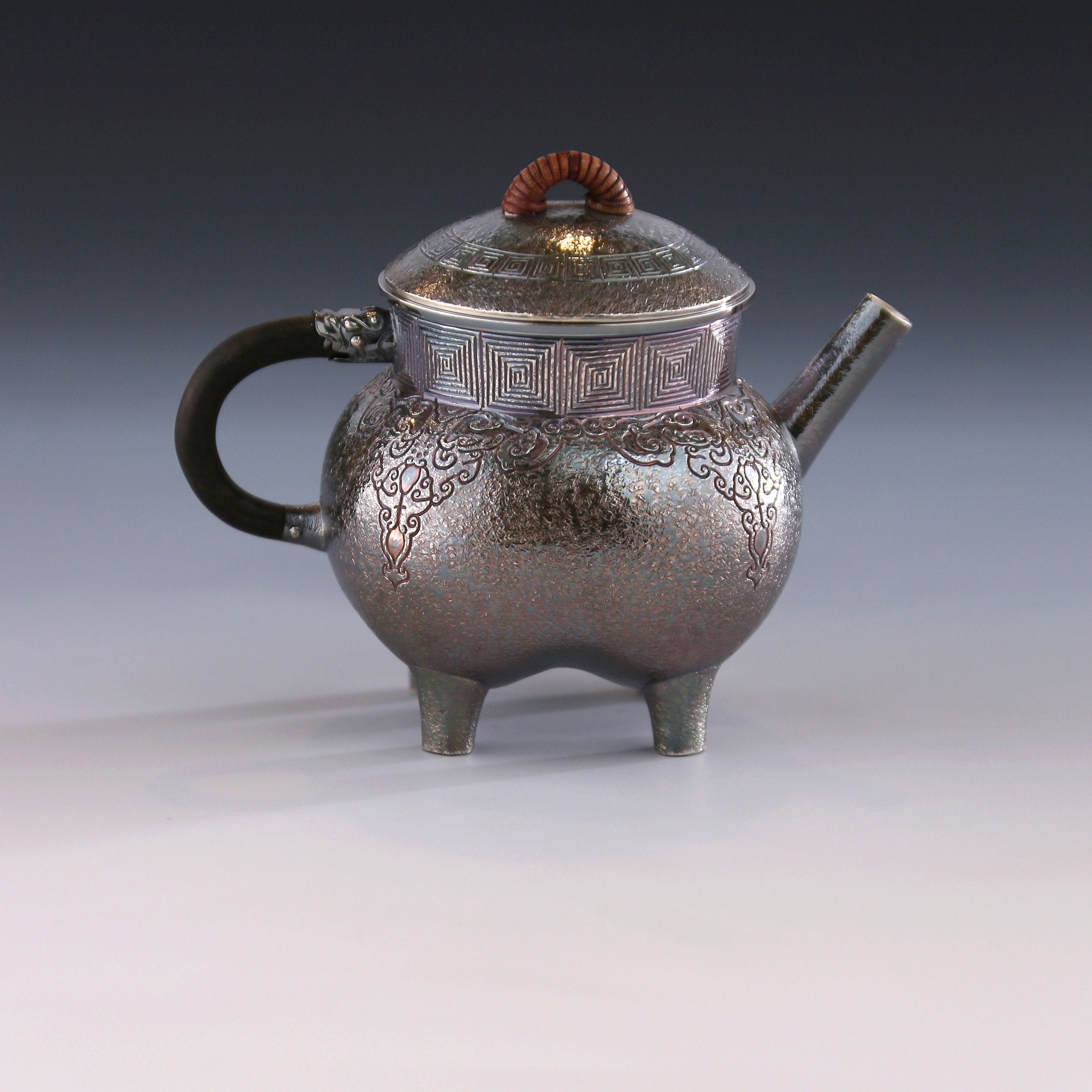 Four-legged silver ewer with dragon design