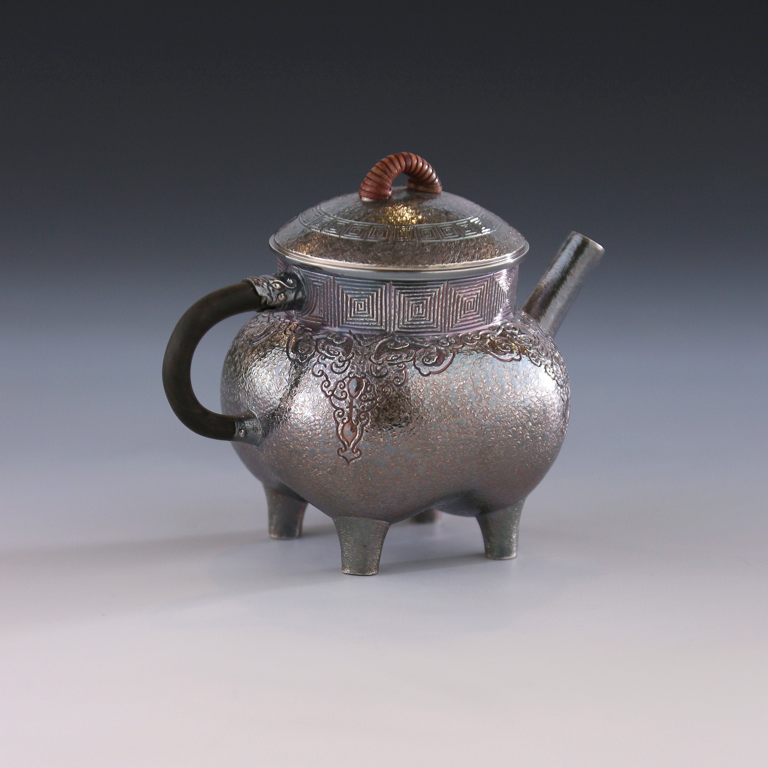 Four-legged silver ewer with dragon design