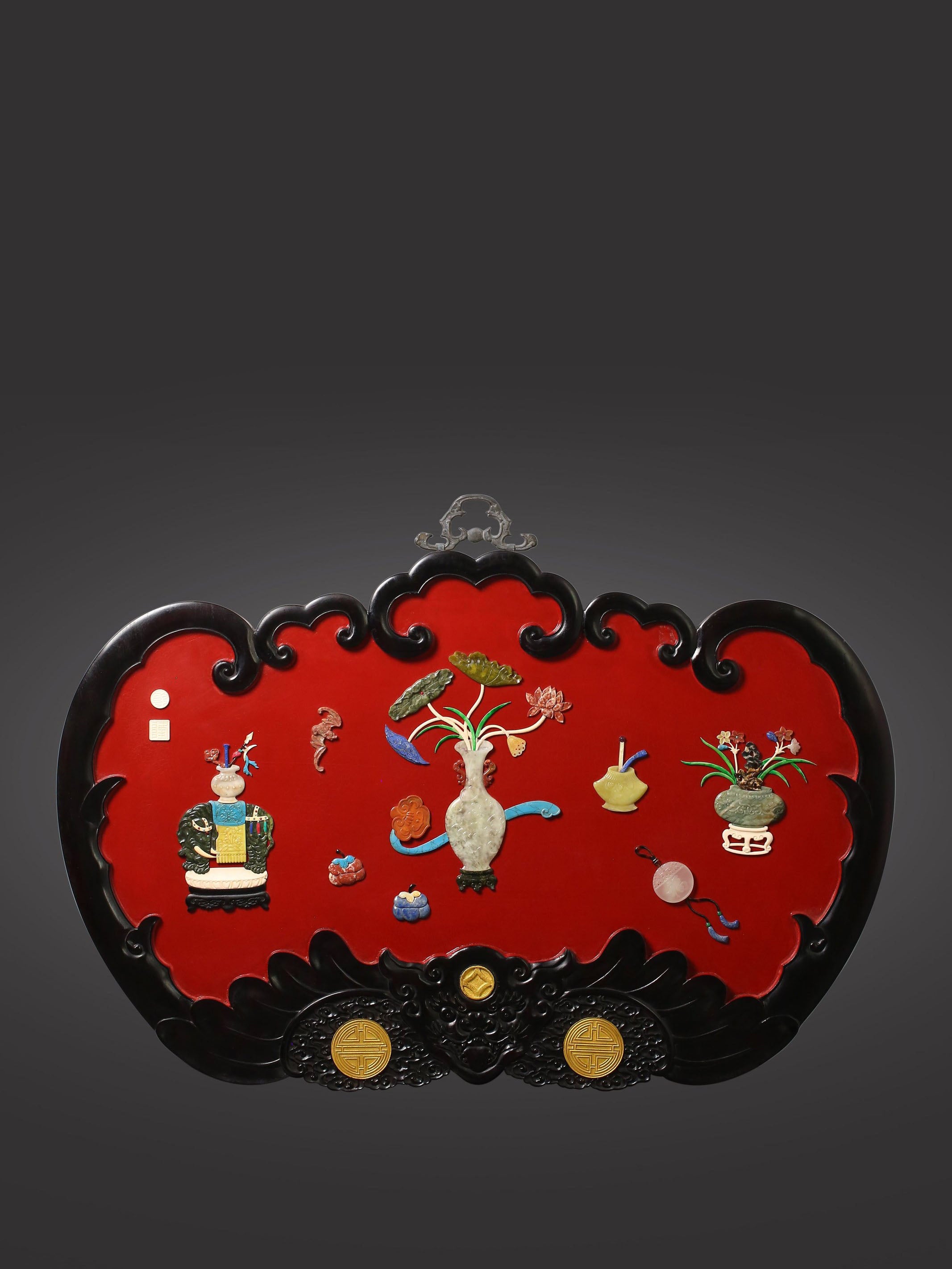 A hanging screen inlaid with precious stones, symbolizing peace and prosperity.