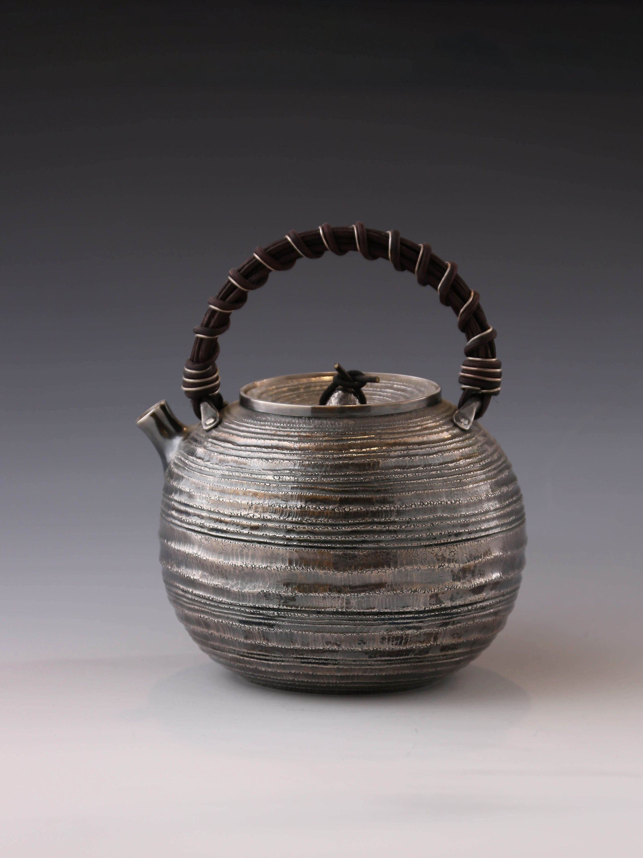 Purple Silver Teapot with Wicker Handle and Swirling Pattern