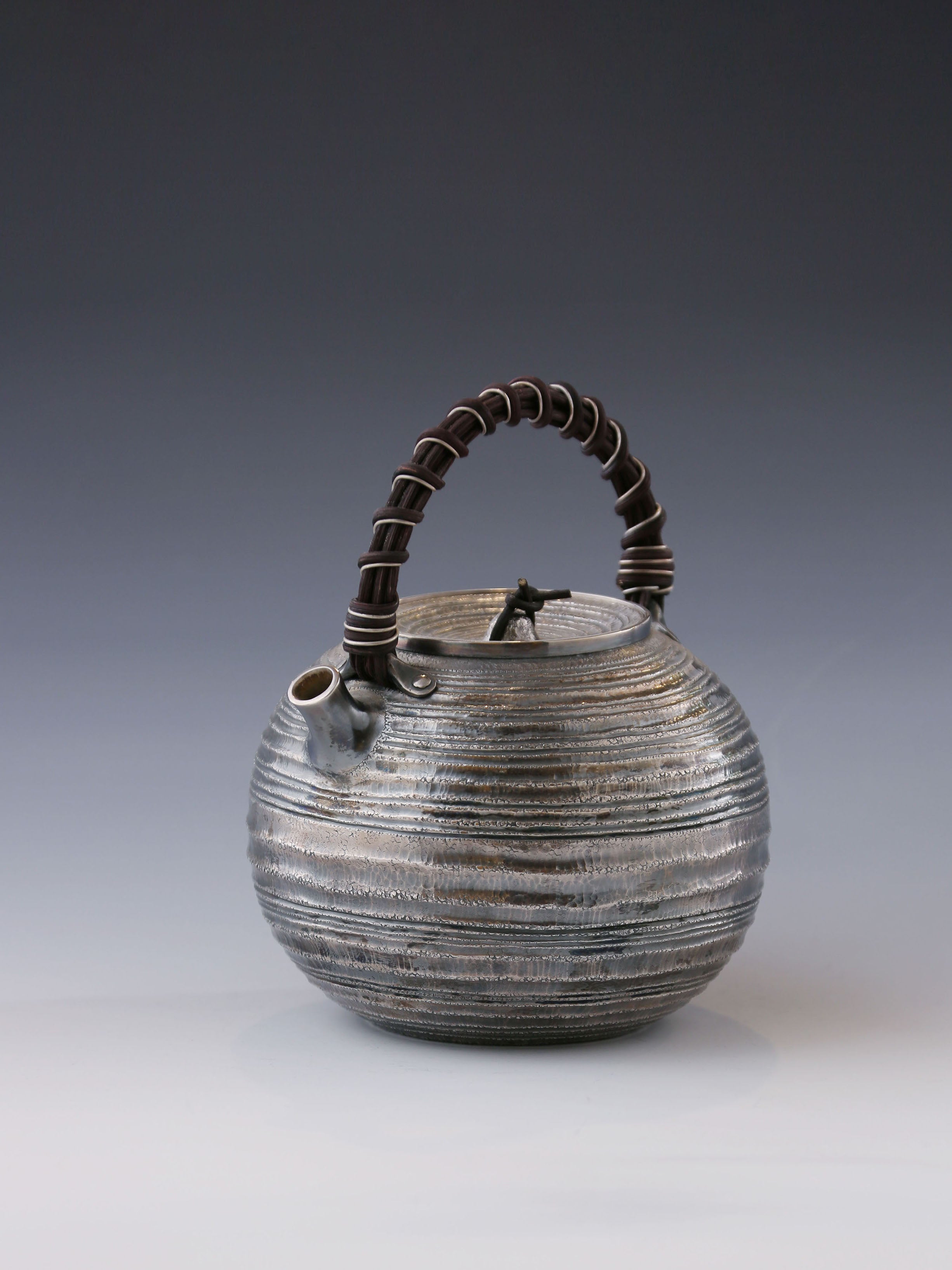 Purple Silver Teapot with Wicker Handle and Swirling Pattern