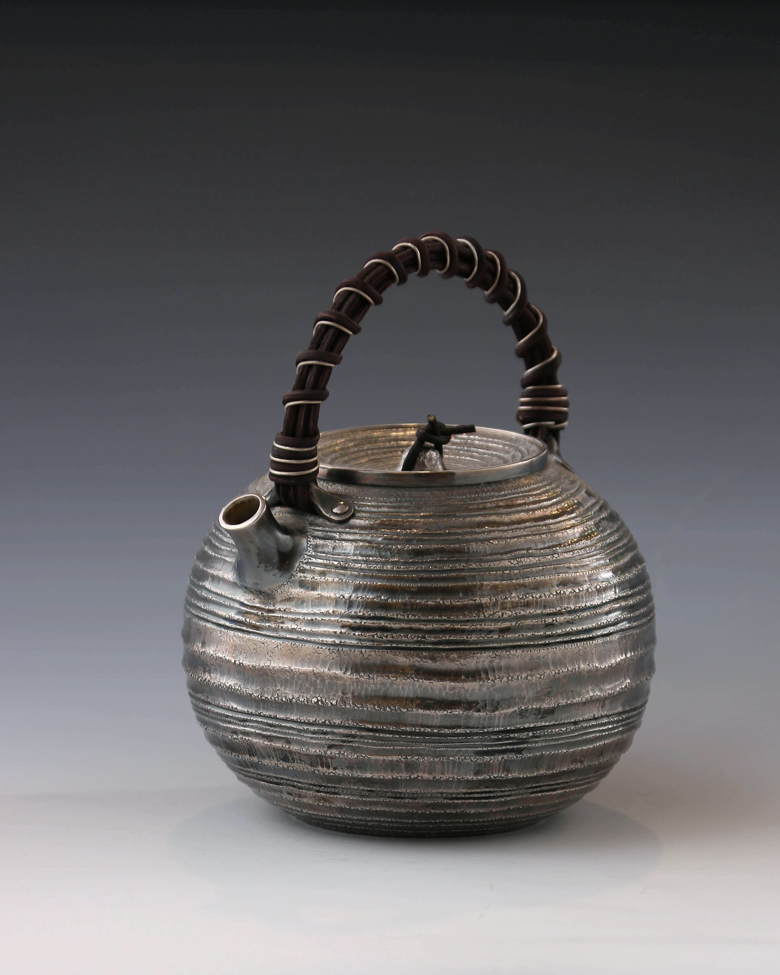 Purple Silver Teapot with Wicker Handle and Swirling Pattern