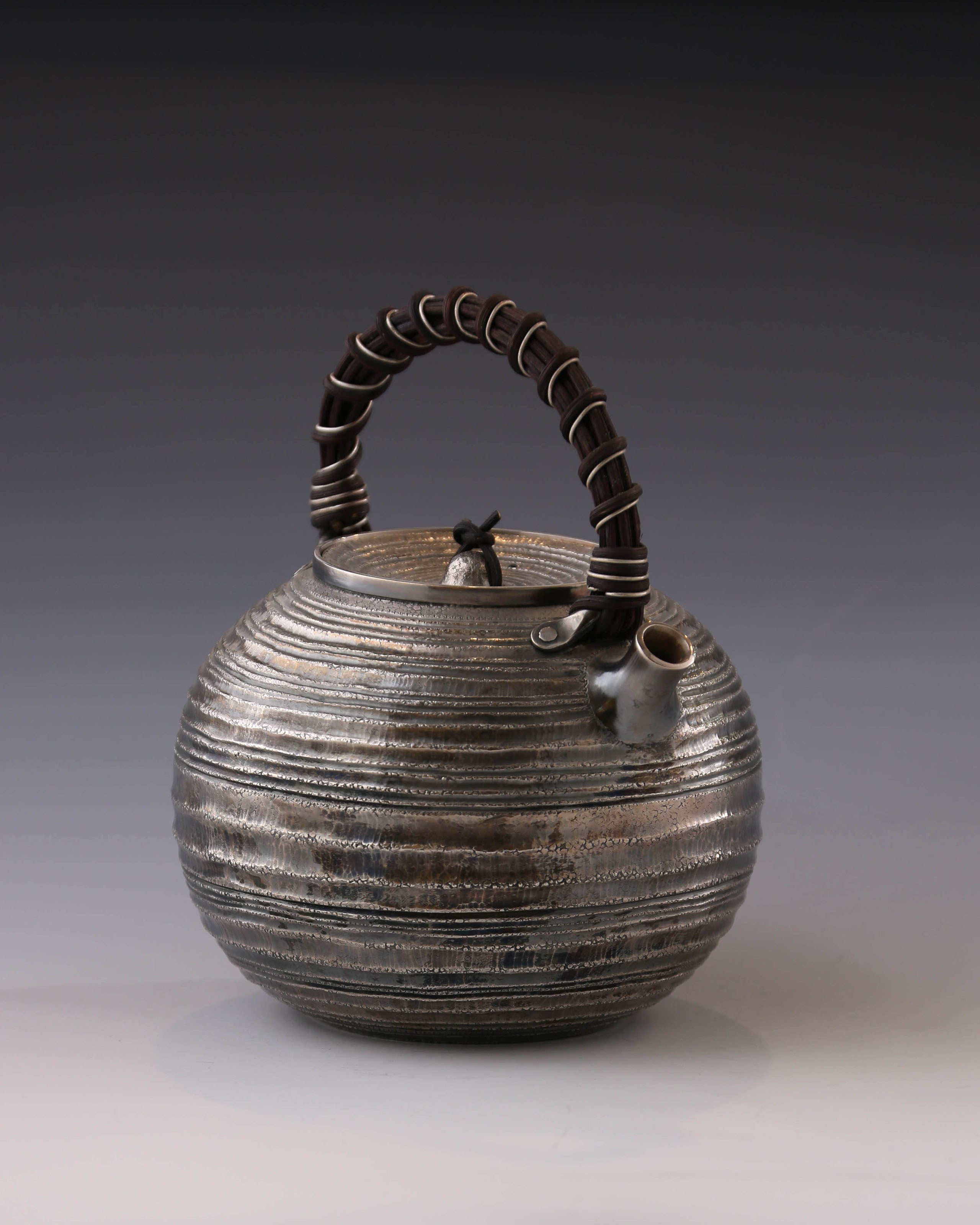 Purple Silver Teapot with Wicker Handle and Swirling Pattern