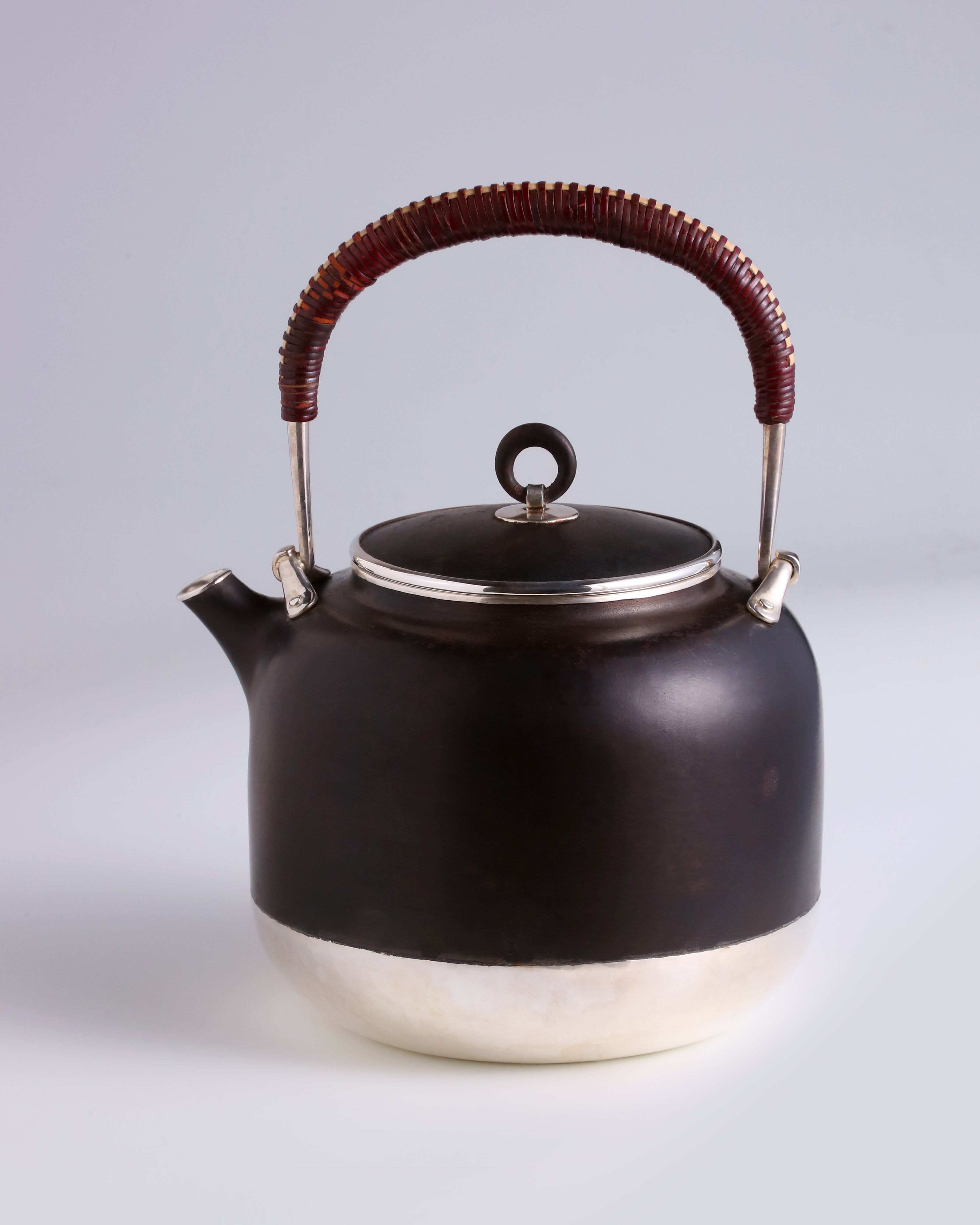 Iron-clad silver flower and bird inlaid gold and silver teapot