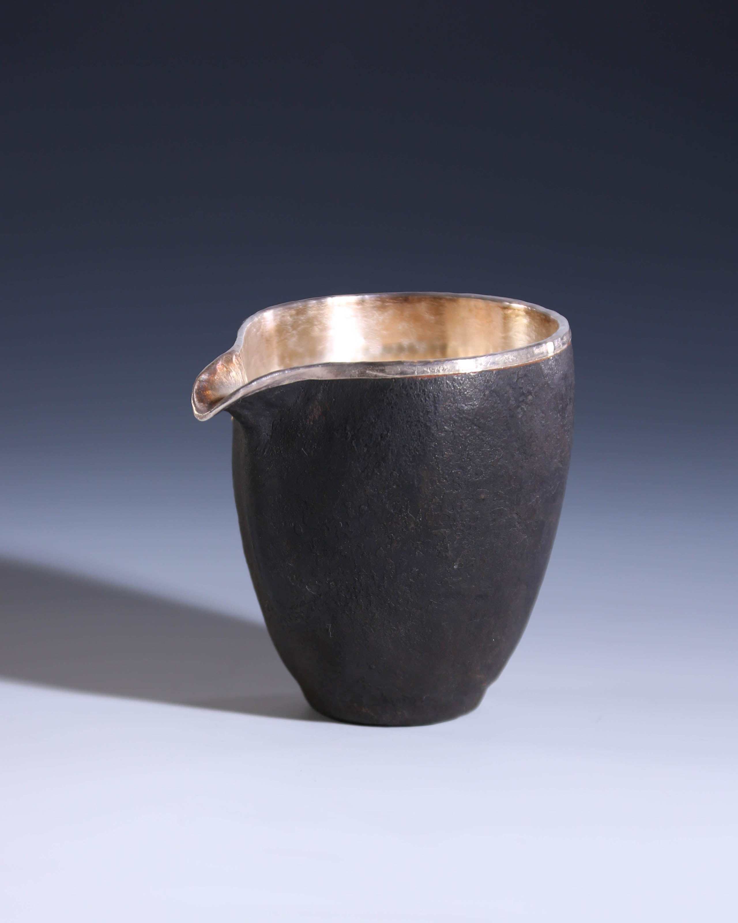Iron-clad silver-studded fair cup