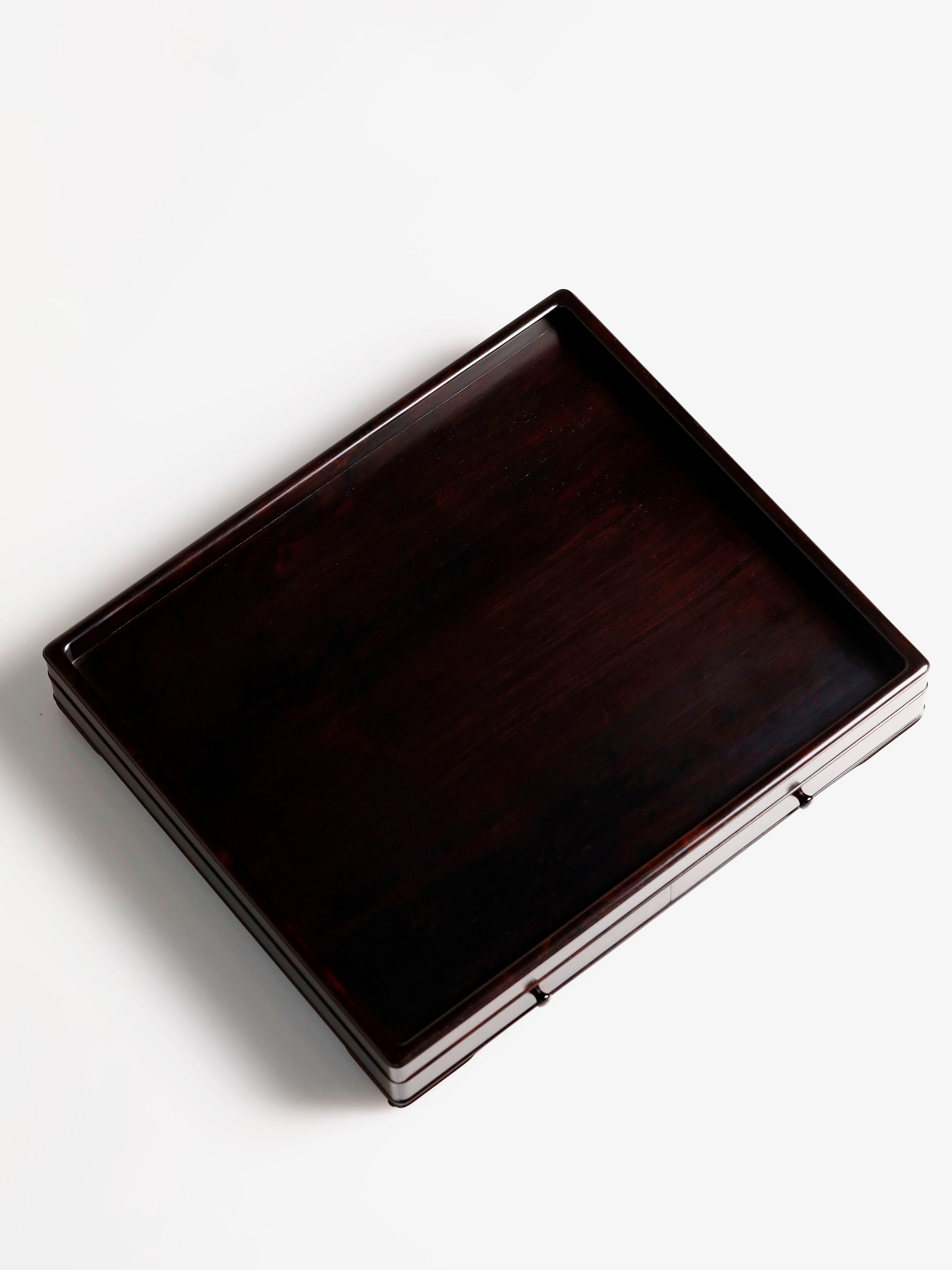 A plain-faced plate inlaid with burl wood on small-leaf red sandalwood, and a plate inlaid with purple sandalwood.