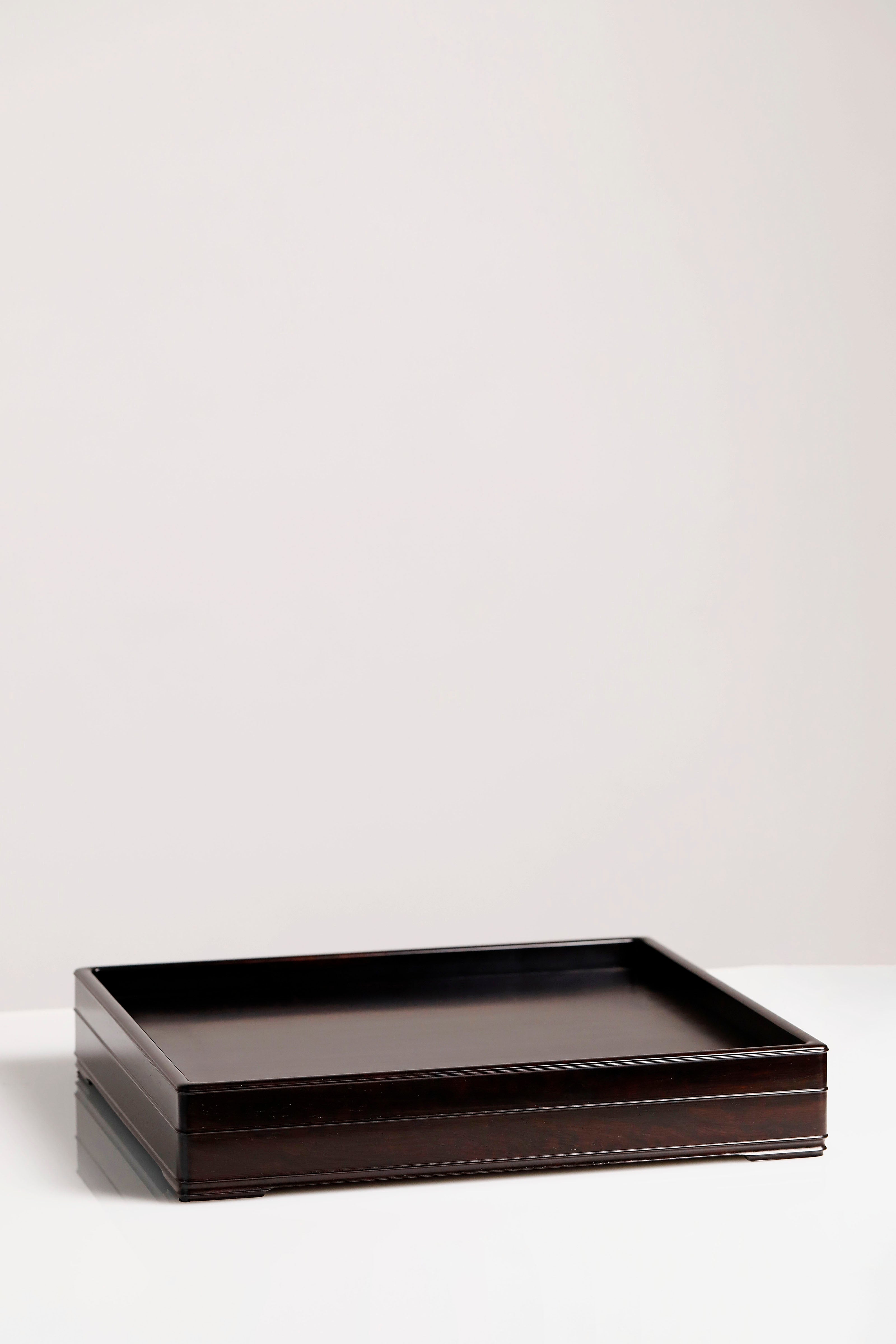 A plain-faced plate inlaid with burl wood on small-leaf red sandalwood, and a plate inlaid with purple sandalwood.