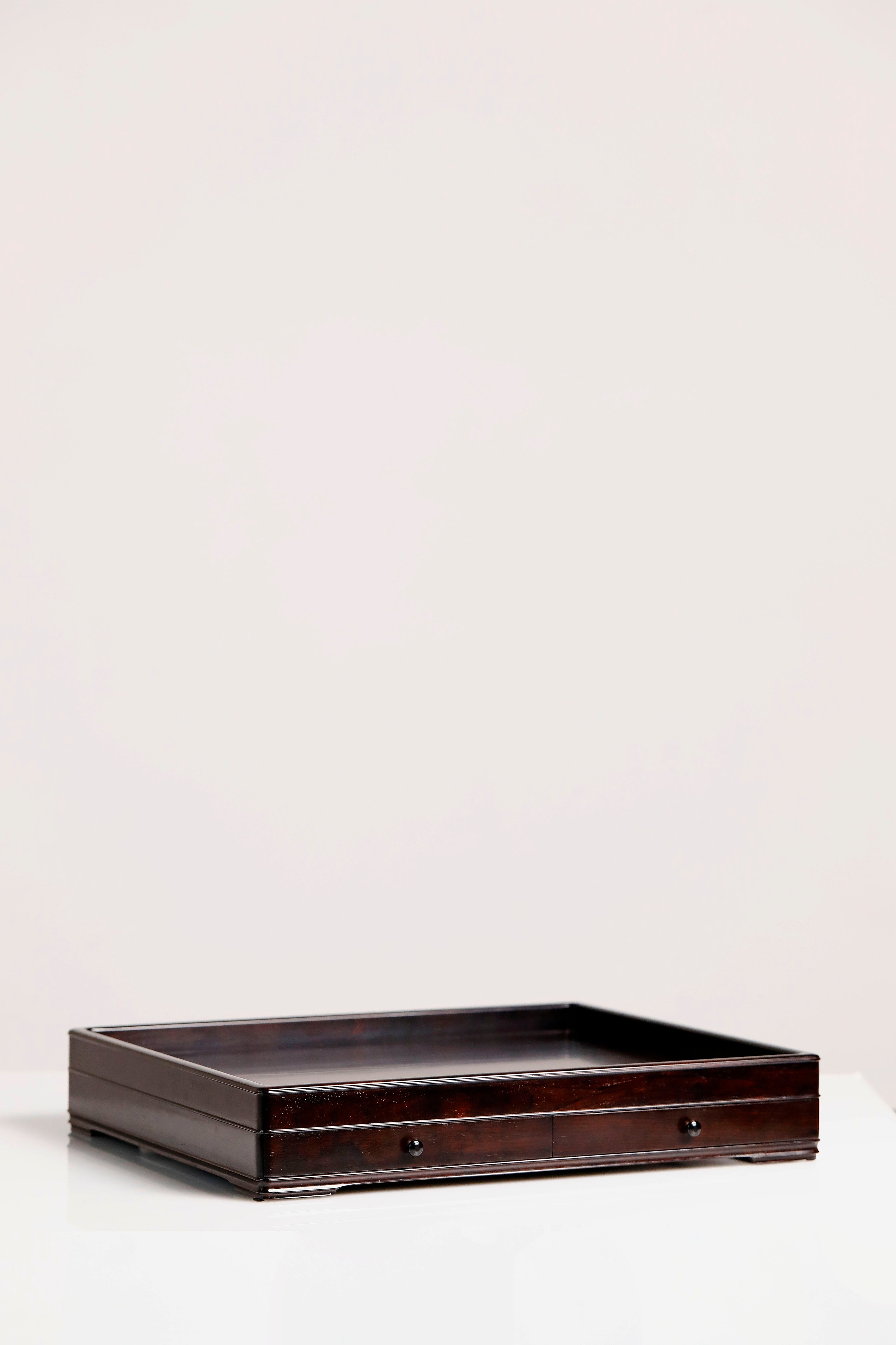 A plain-faced plate inlaid with burl wood on small-leaf red sandalwood, and a plate inlaid with purple sandalwood.