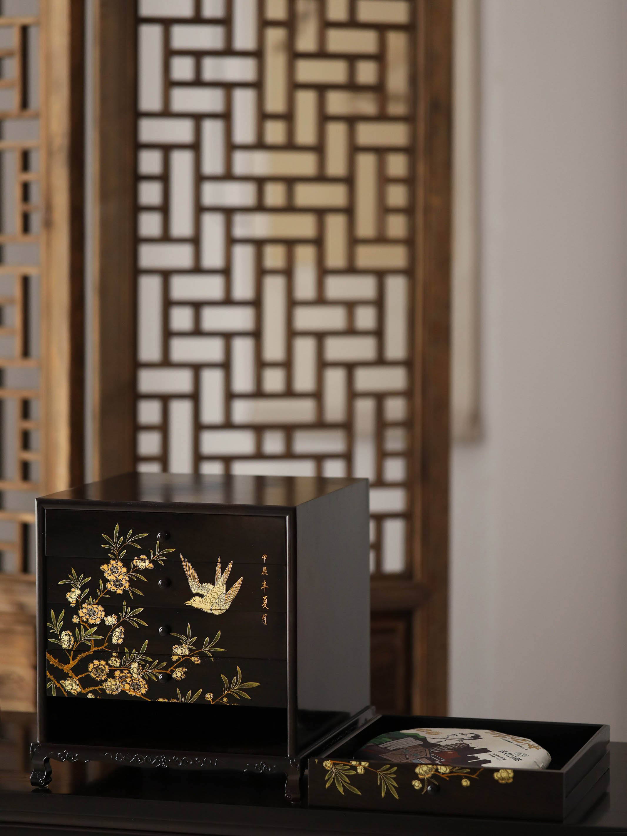 Gold piled high, joy on eyebrows / Wealth and good fortune on the table, five cups of tea on the sideboard