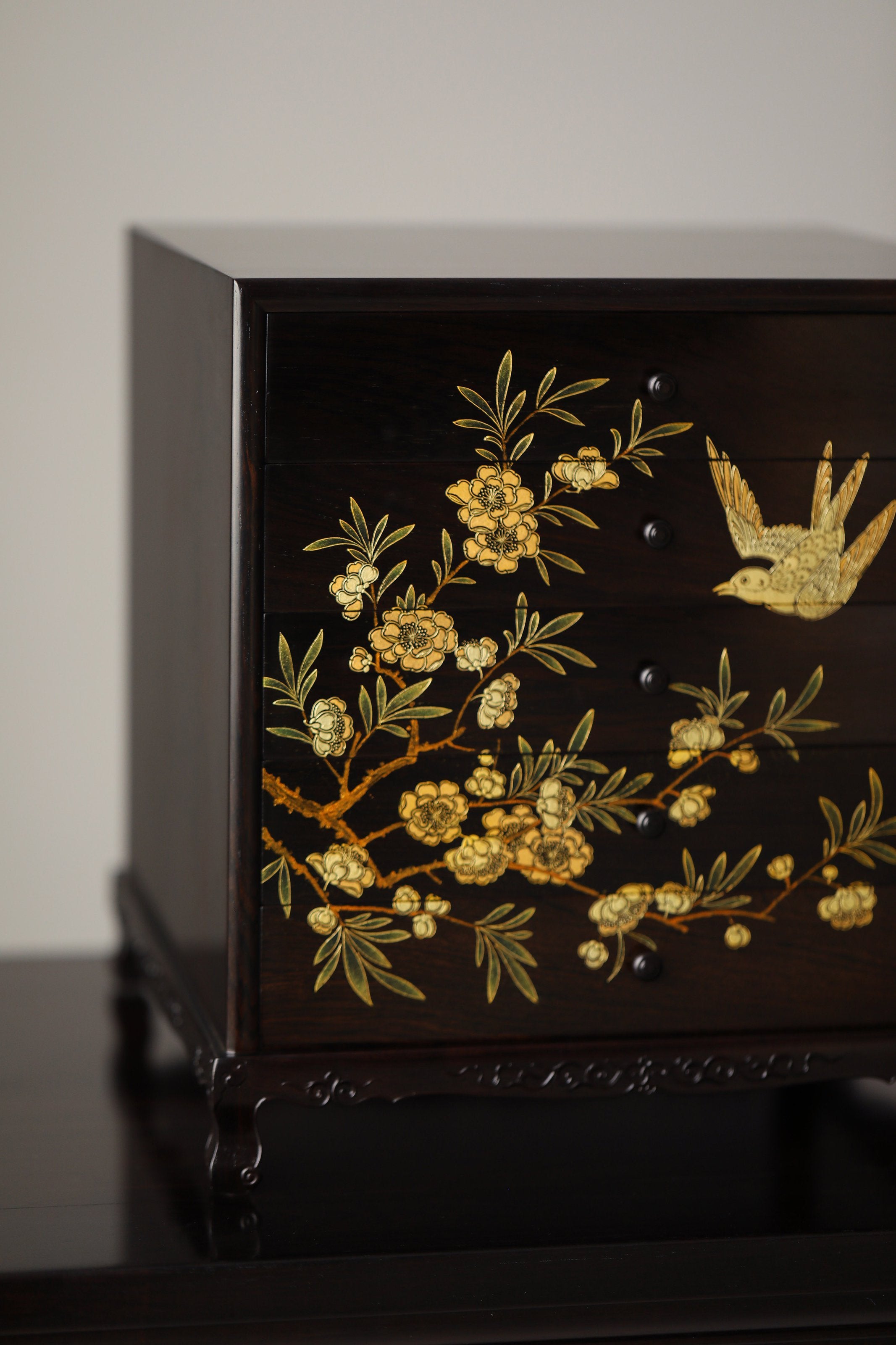 Gold piled high, joy on eyebrows / Wealth and good fortune on the table, five cups of tea on the sideboard