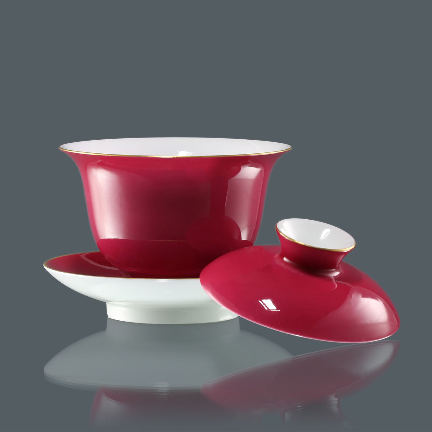 Rouge stains the bowl with gold, / Rouge leaves a trail of intoxication.