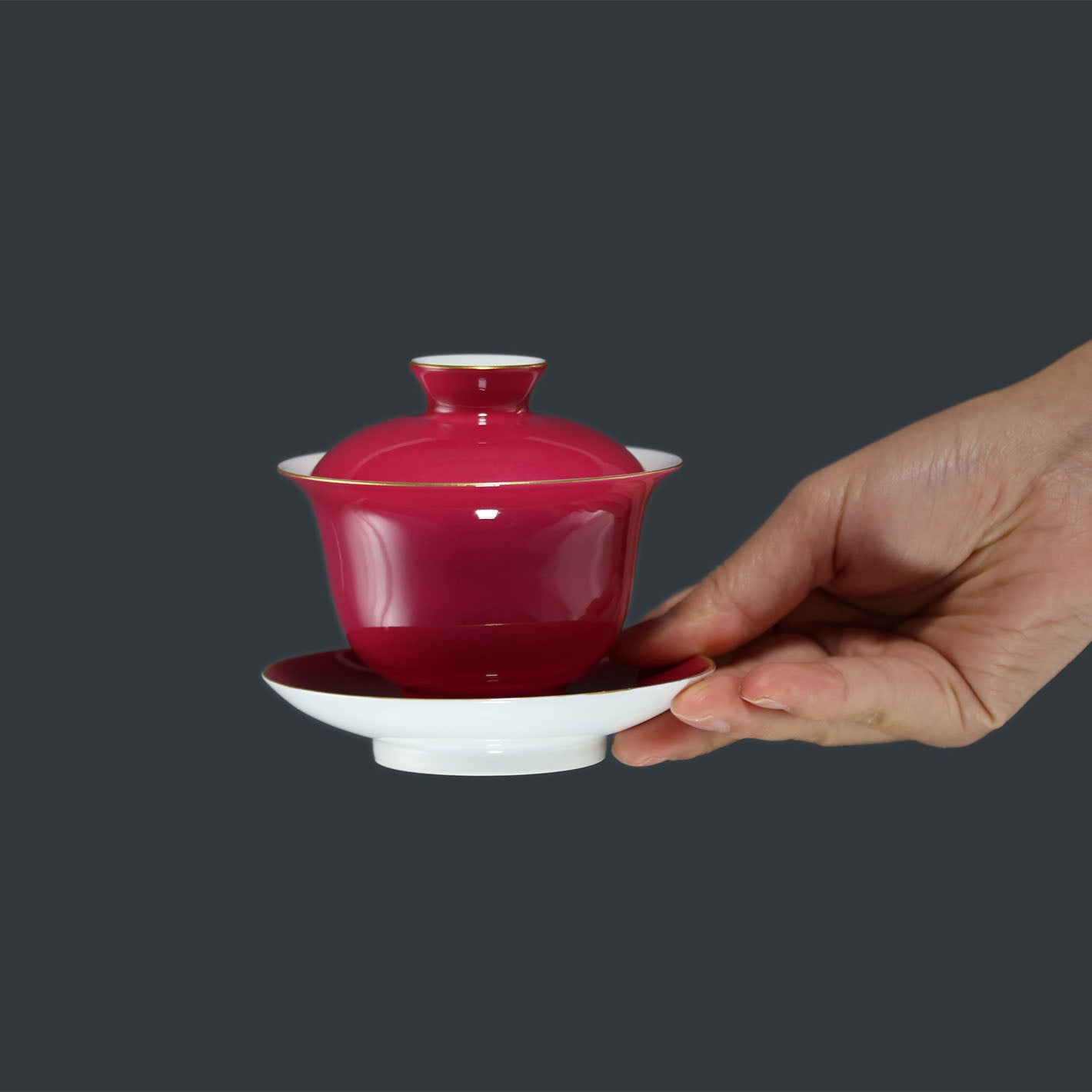 Rouge stains the bowl with gold, / Rouge leaves a trail of intoxication.