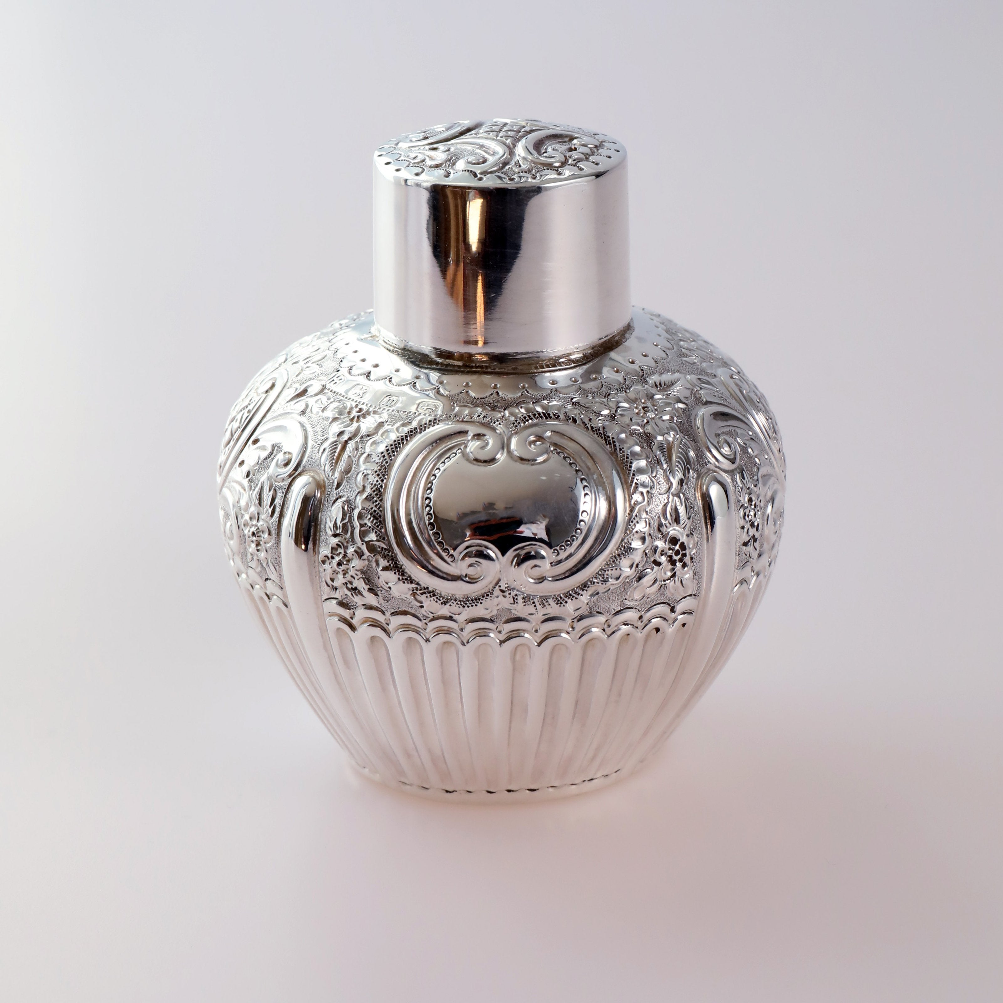 1896 British sterling silver embossed tea caddy