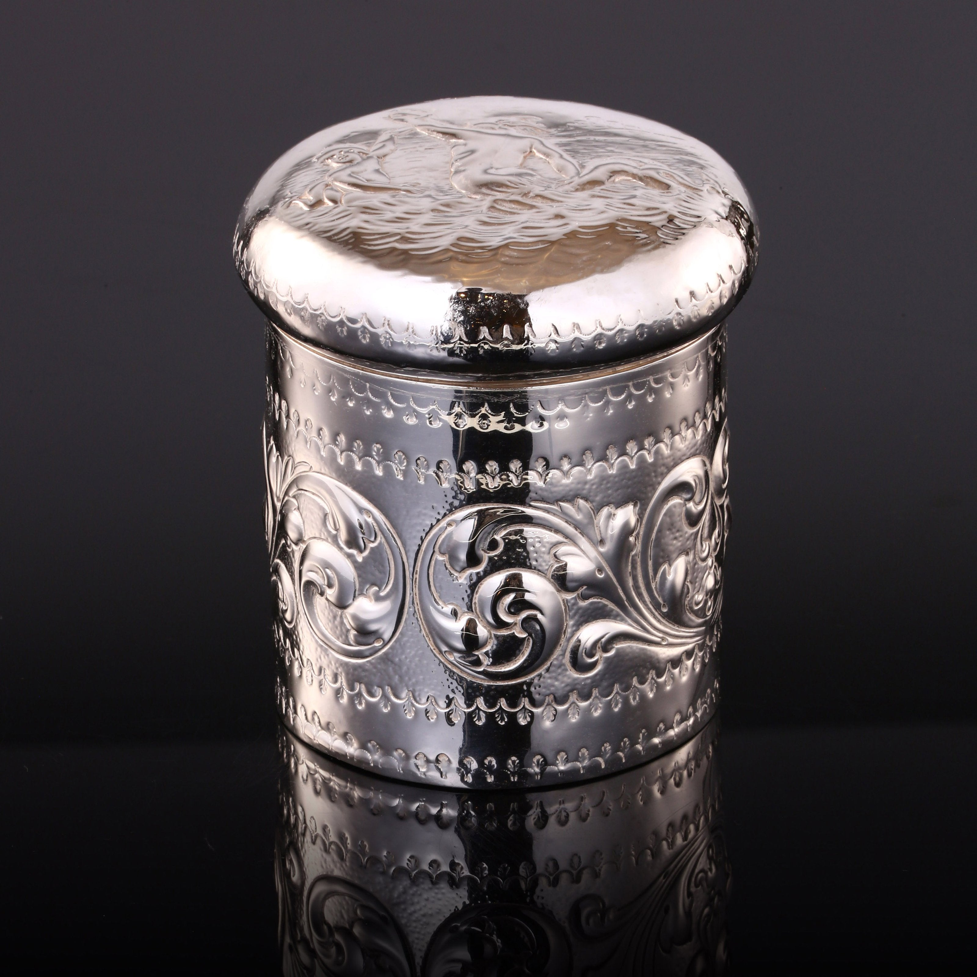 1884 British sterling silver tea caddy with relief floral and figure design
