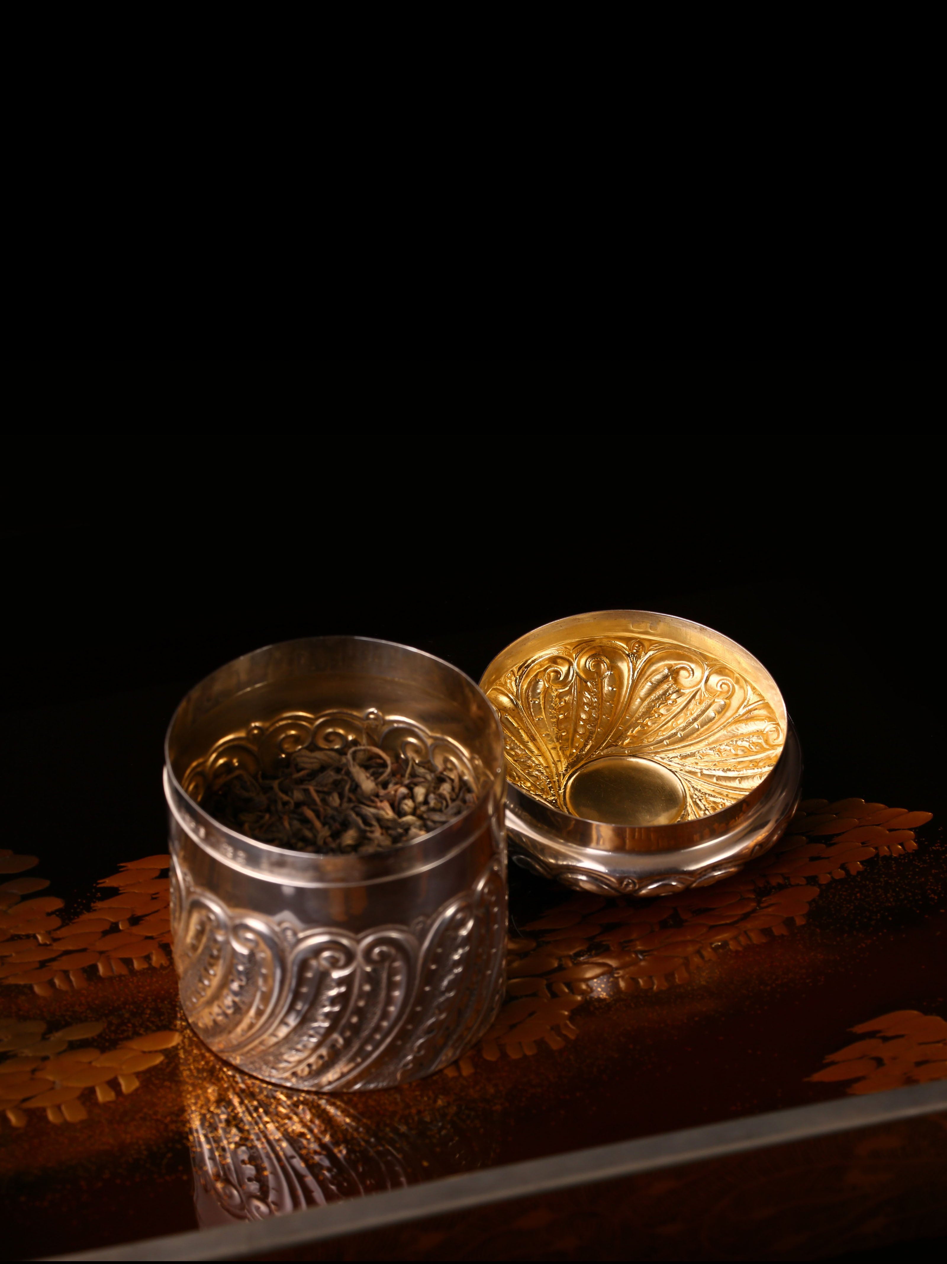 1901 British sterling silver tea caddy with scrollwork design