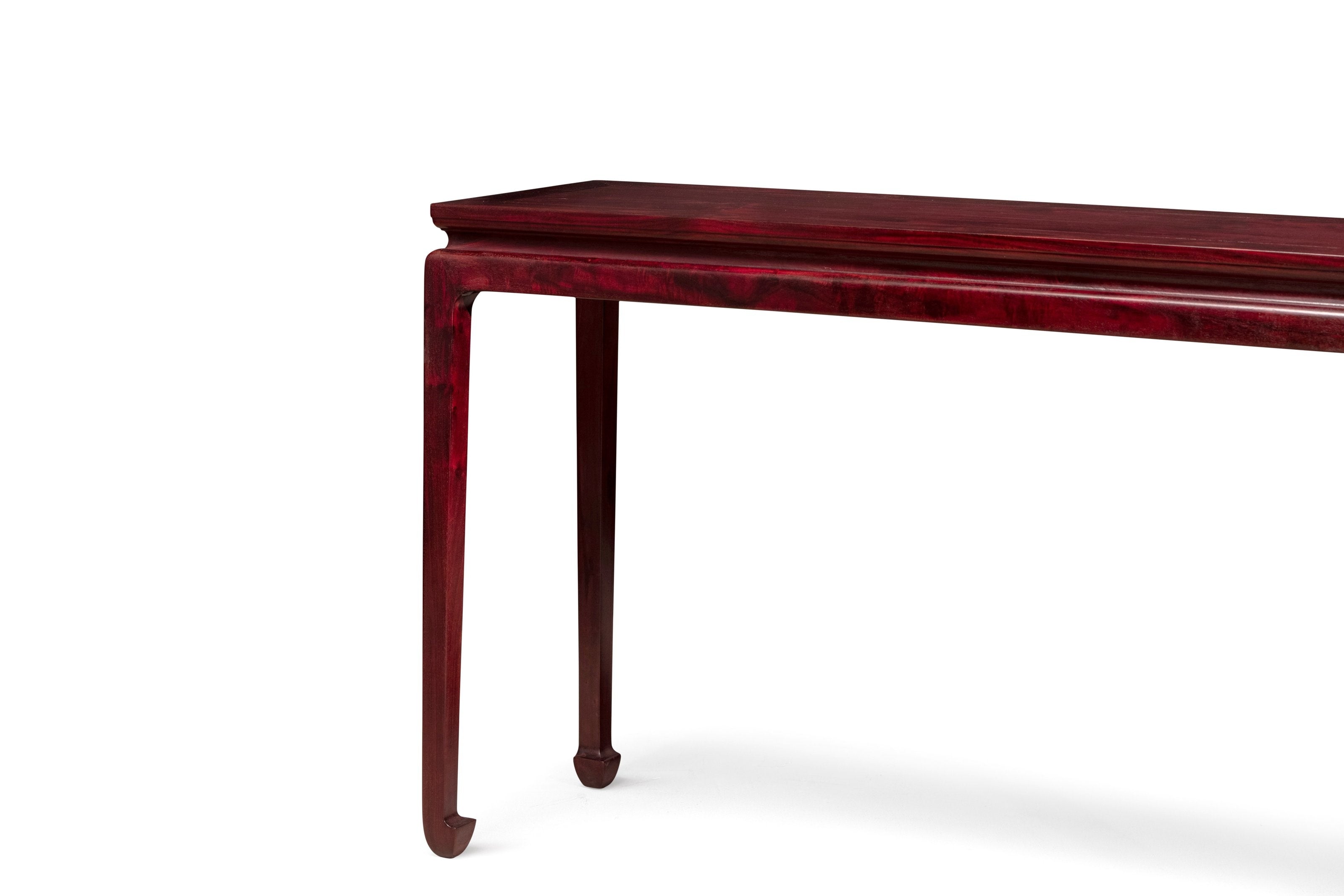 Long table with waisted legs and hoof feet