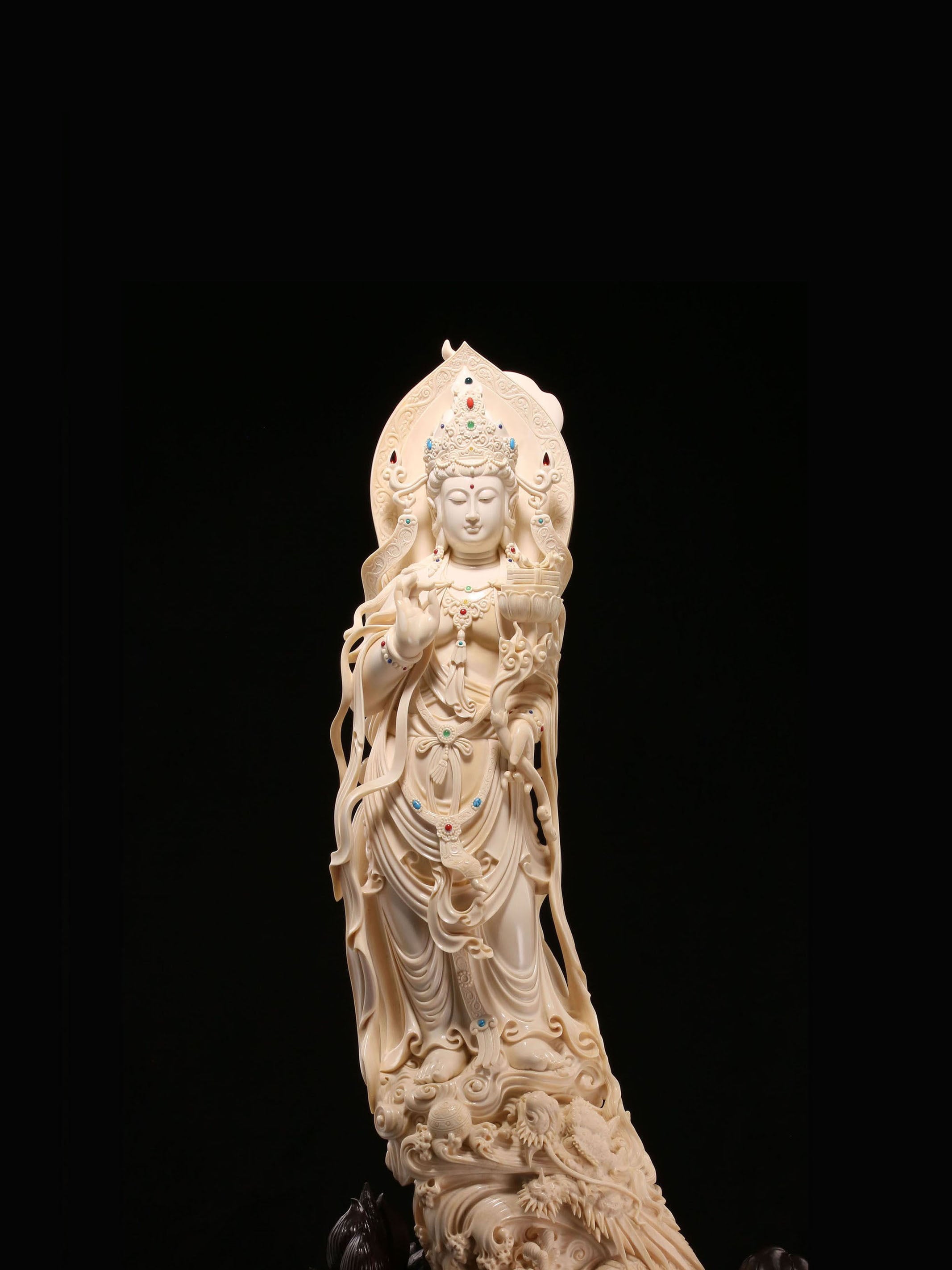 Guanyin holding a lotus and riding a dragon