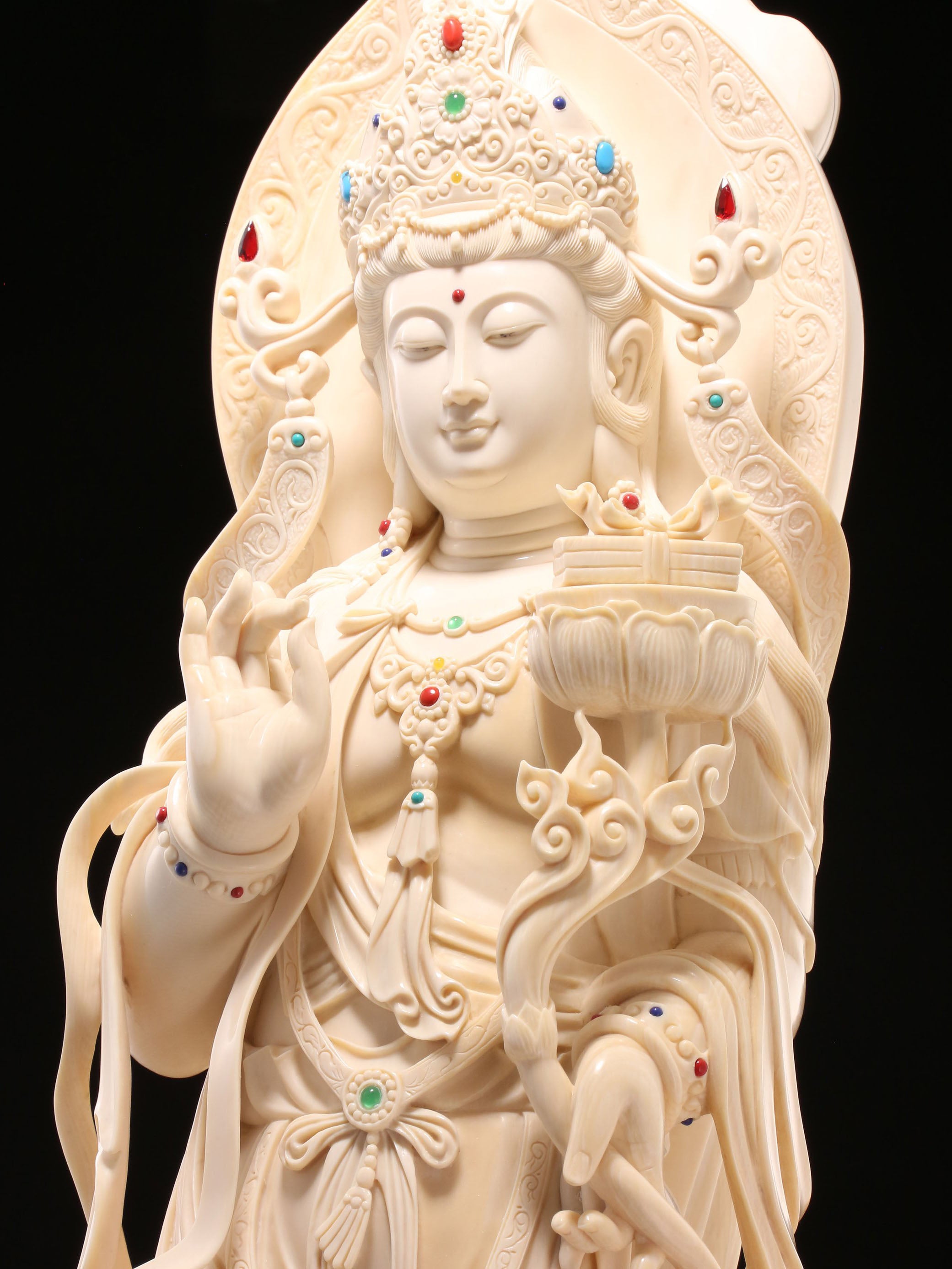 Guanyin holding a lotus and riding a dragon