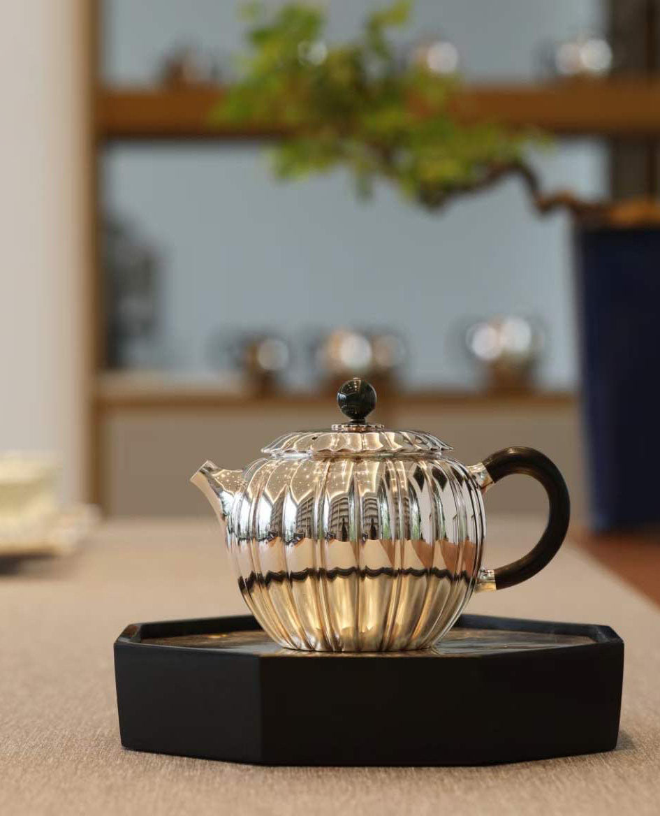 Jade-patterned sterling silver teapot