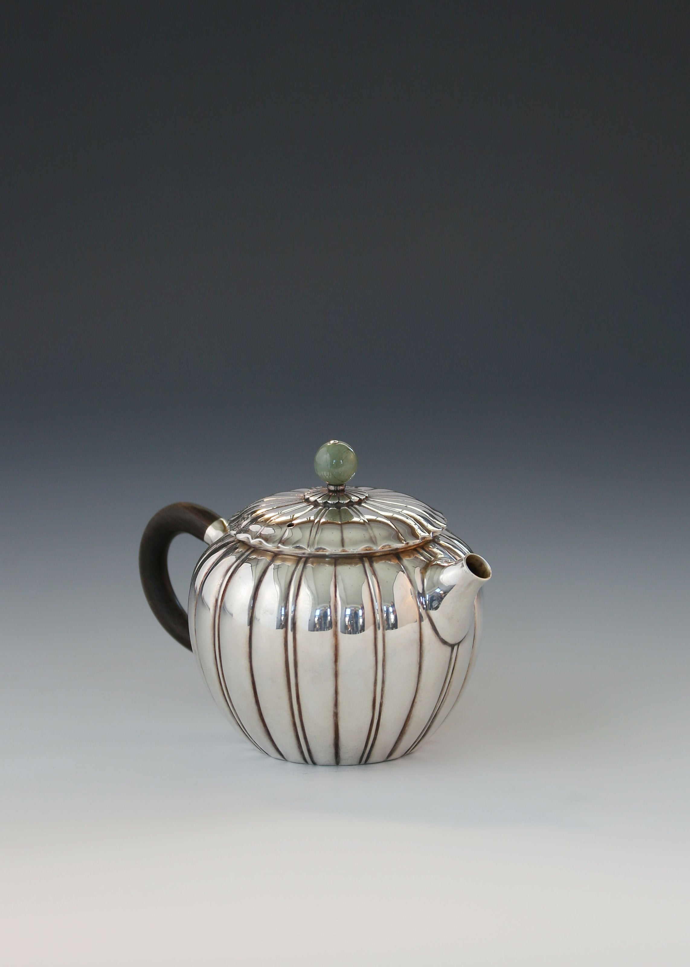Jade-patterned sterling silver teapot