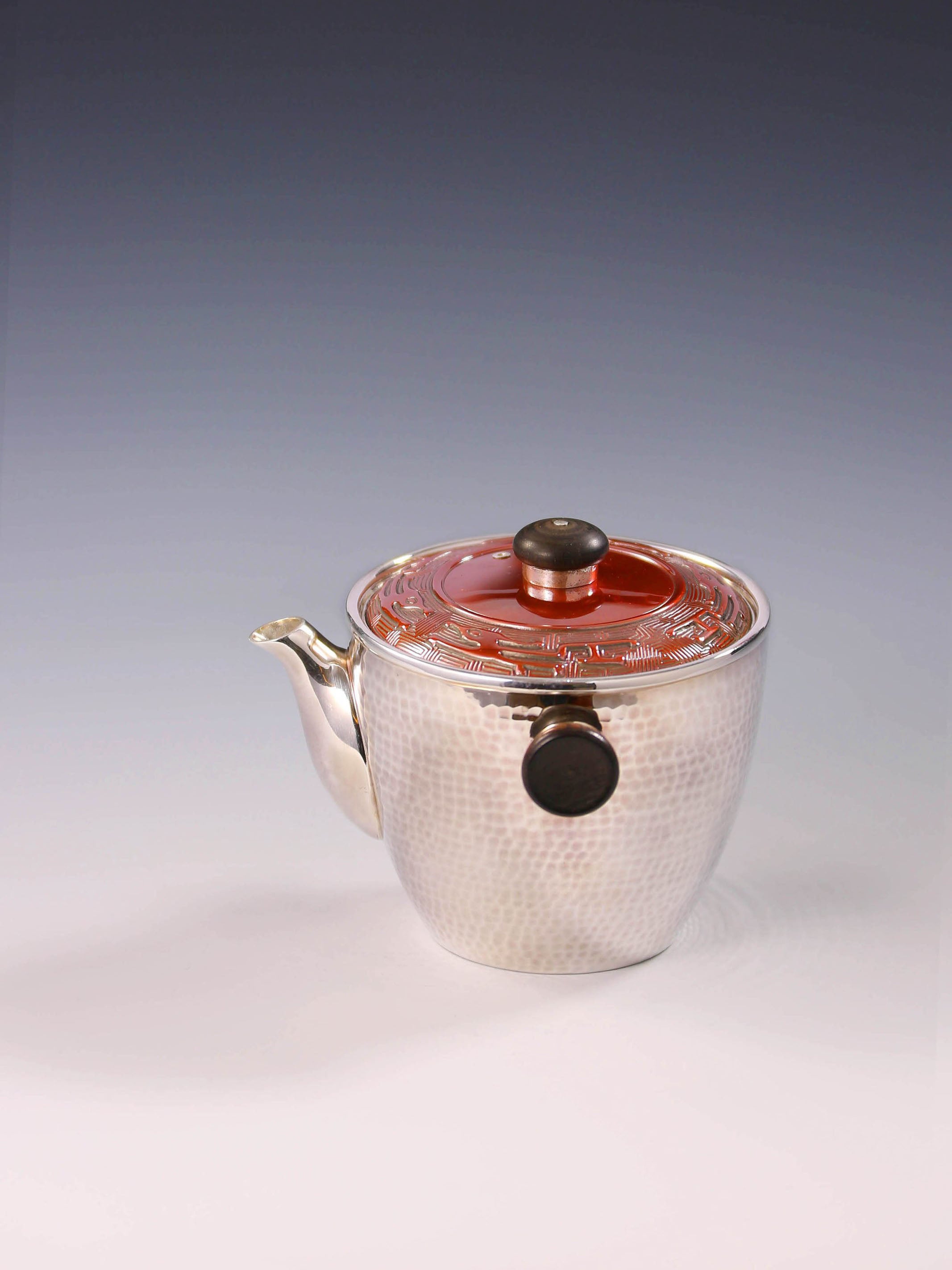 Vermilion-covered silver teapot
