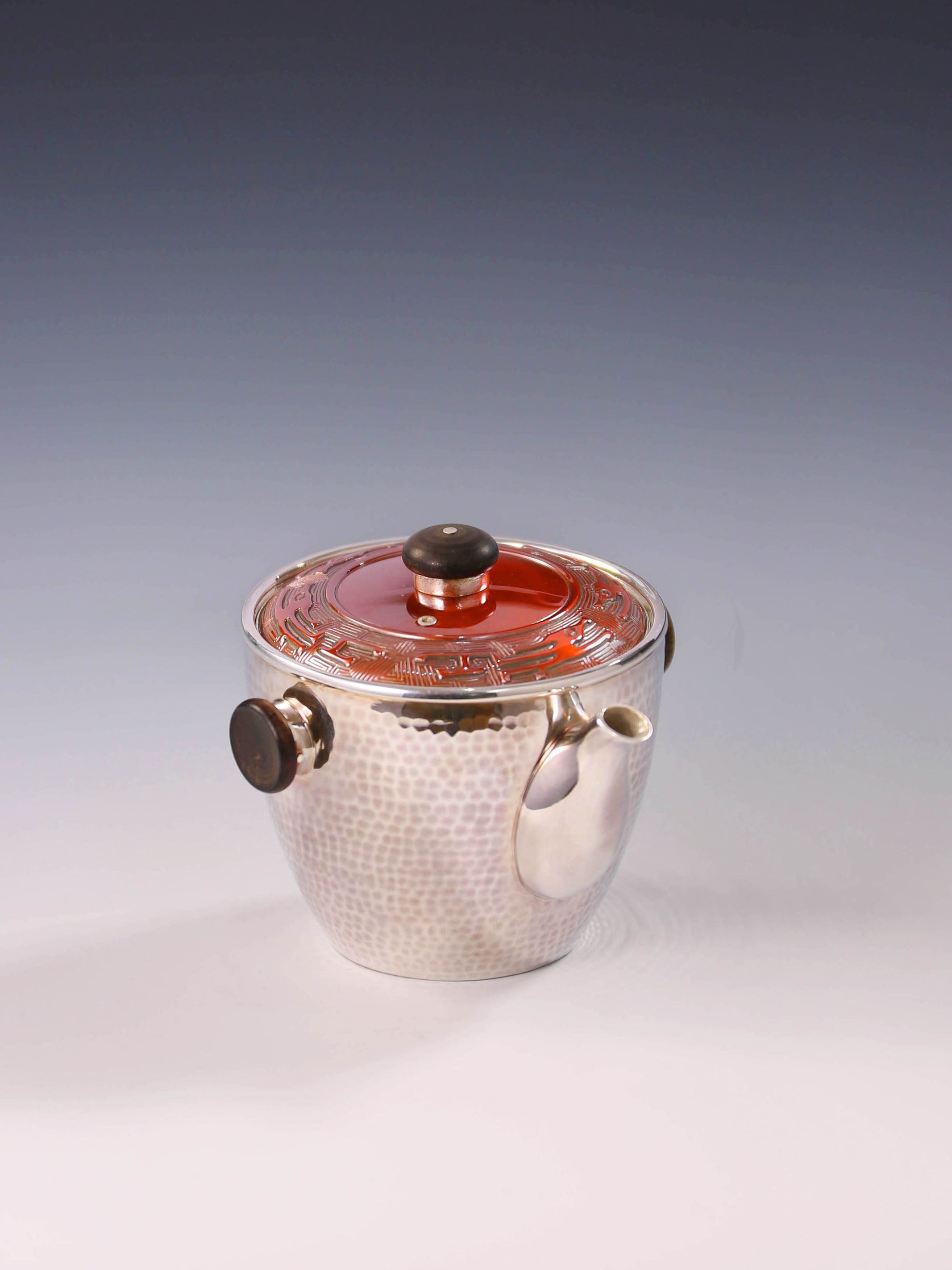 Vermilion-covered silver teapot