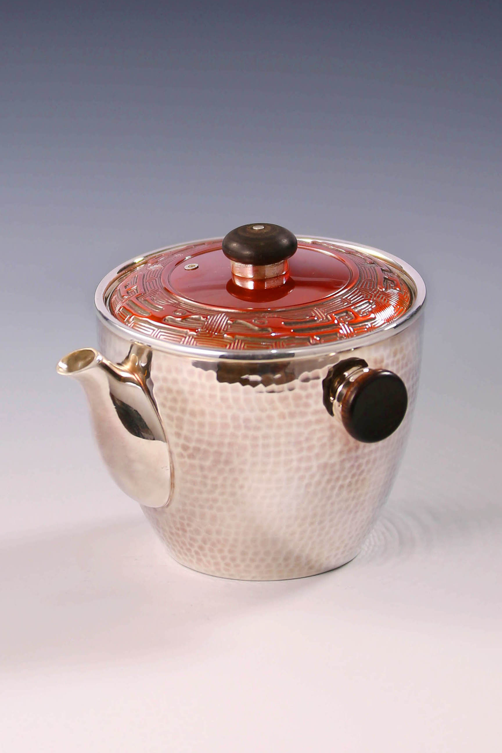 Vermilion-covered silver teapot