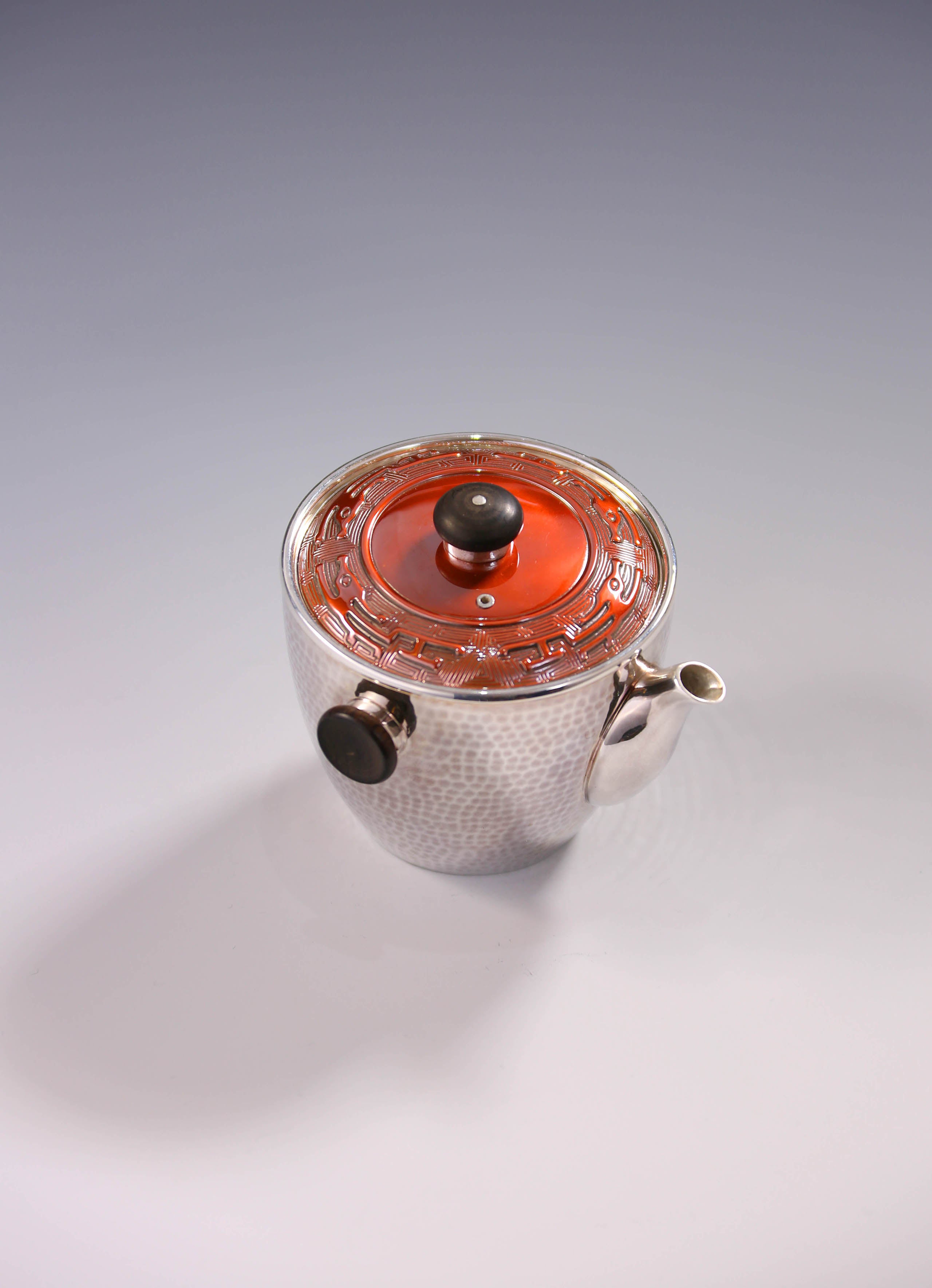 Vermilion-covered silver teapot