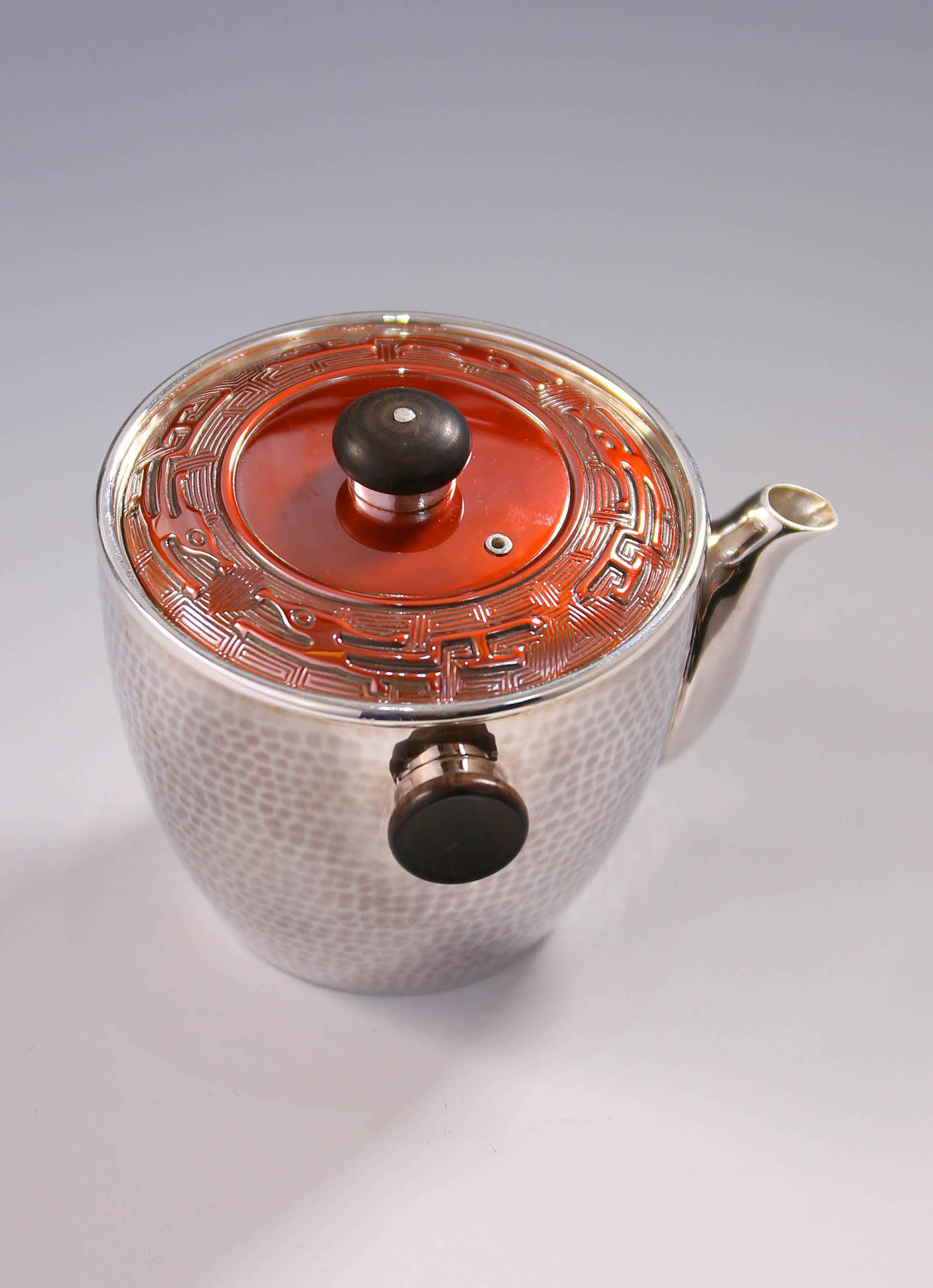 Vermilion-covered silver teapot
