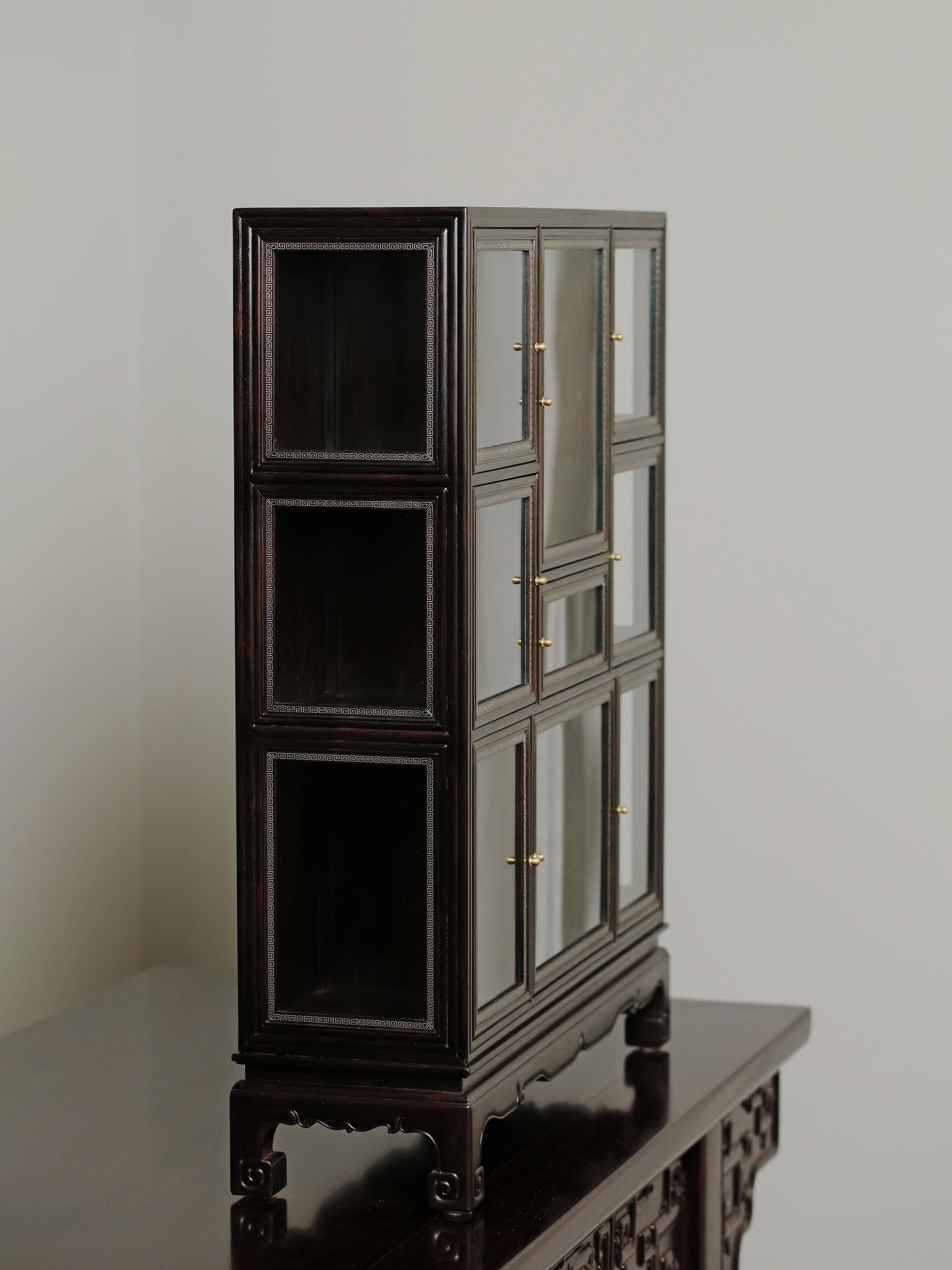 Purple sandalwood inlaid with silver wire fretwork multi-treasure cabinet