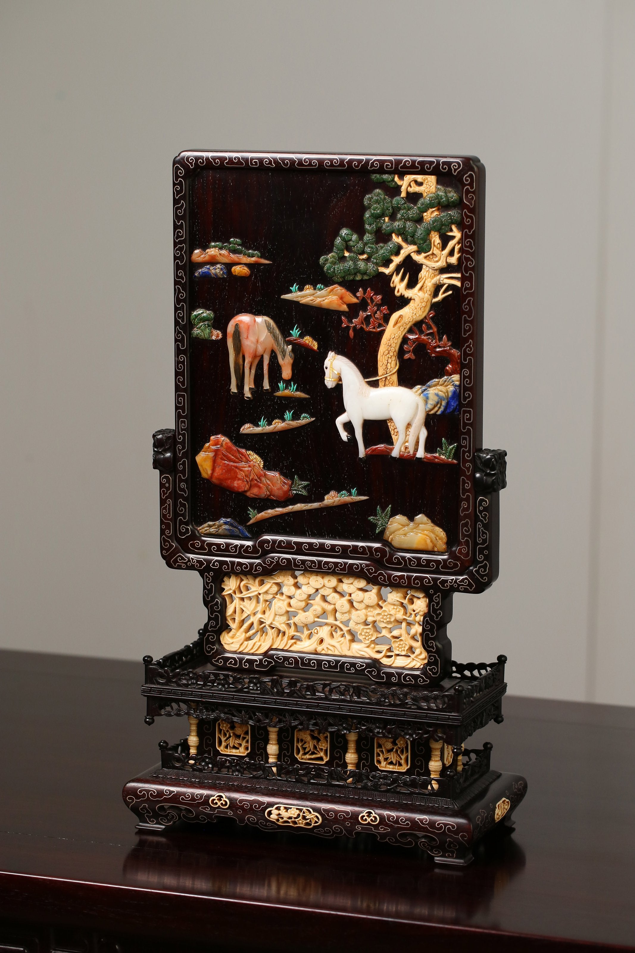 Rosewood screen inlaid with precious stones and mammoth ivory